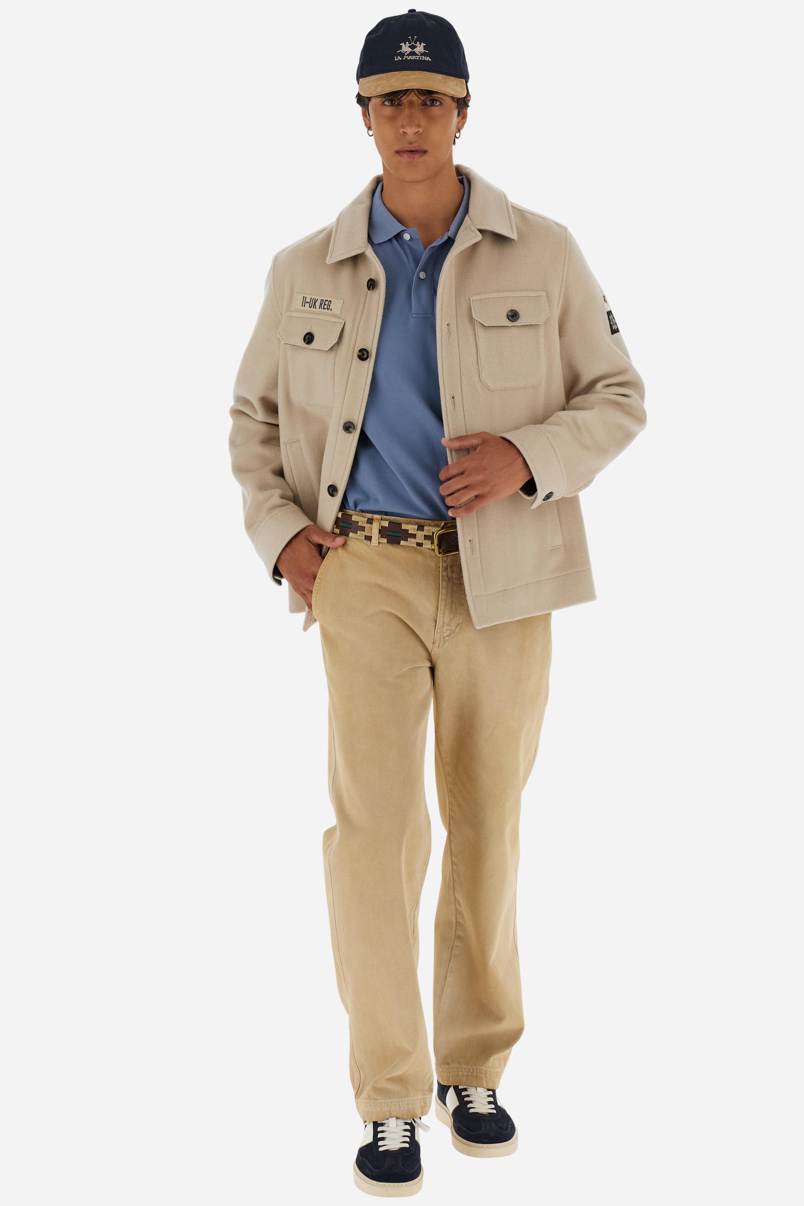 Men's Carpenter trousers in pure bull cotton. The classic five-pocket construction features a relaxed fit through the hips and thighs, with straight, wide legs.The fabric undergoes an authentic faded treatment that gives it a lived-in character and a used effect with contemporary appeal. The brand's guarantee label is applied to the back pocket, while the logo appears on a faux leather patch attached to the back of the wasitband.The model is wearing a size 33. - Bone Brown