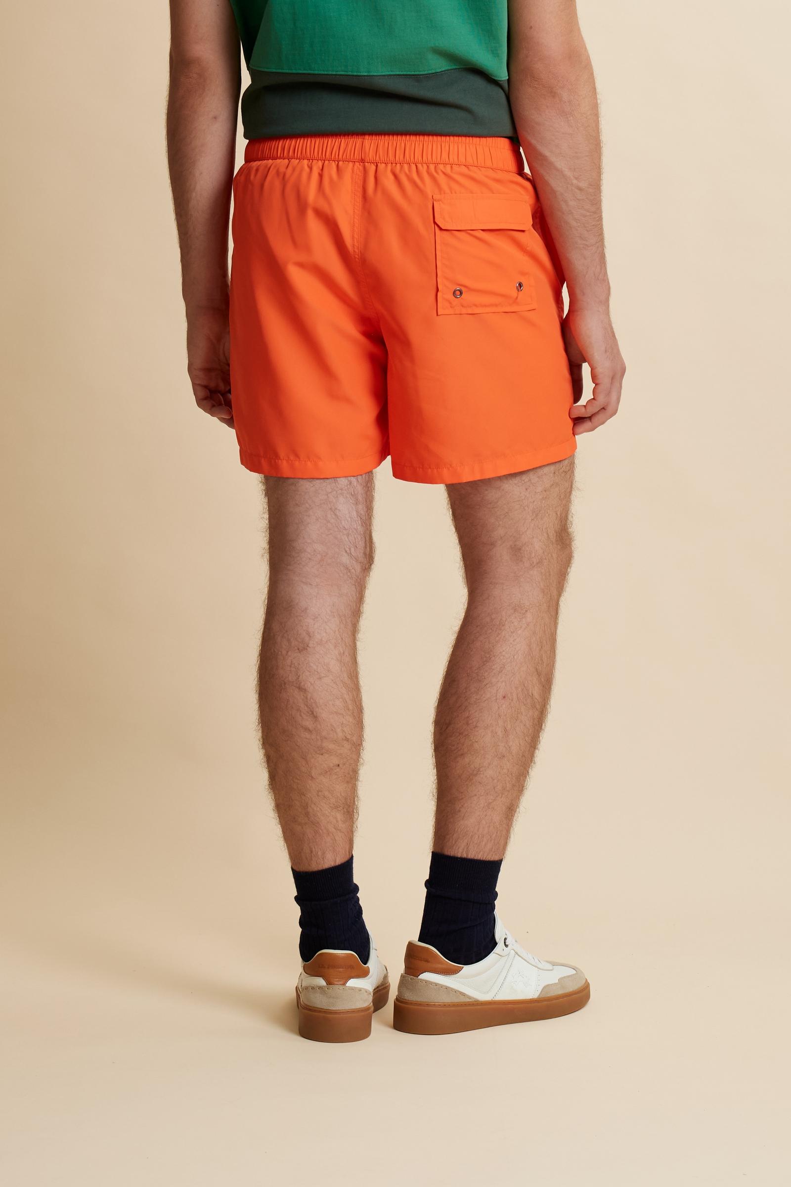 Men’s solid nylon mid-length swim shorts. Regular fit with elasticated waistband, adjustable drawstring, back pocket and embroidered logo. - Flame