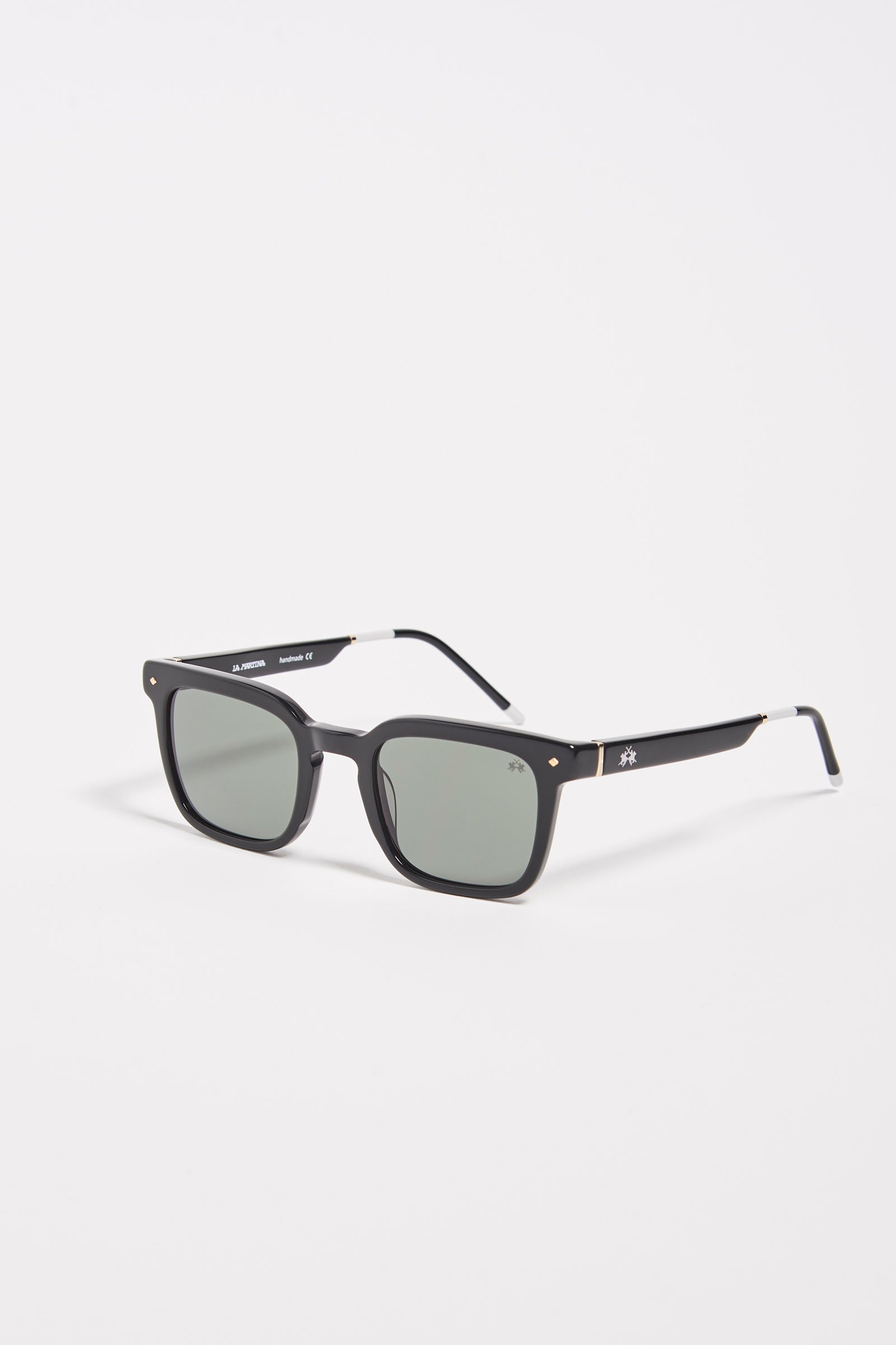 Men's squared sunglasses in acetate material. This classic style model features a small La Martina logo on the temple and lenses with internal blue anti-reflection. The light black frame makes it easy to wear, while the coloring allows you to wear the glasses with any look and always be fashionable. - BLACK