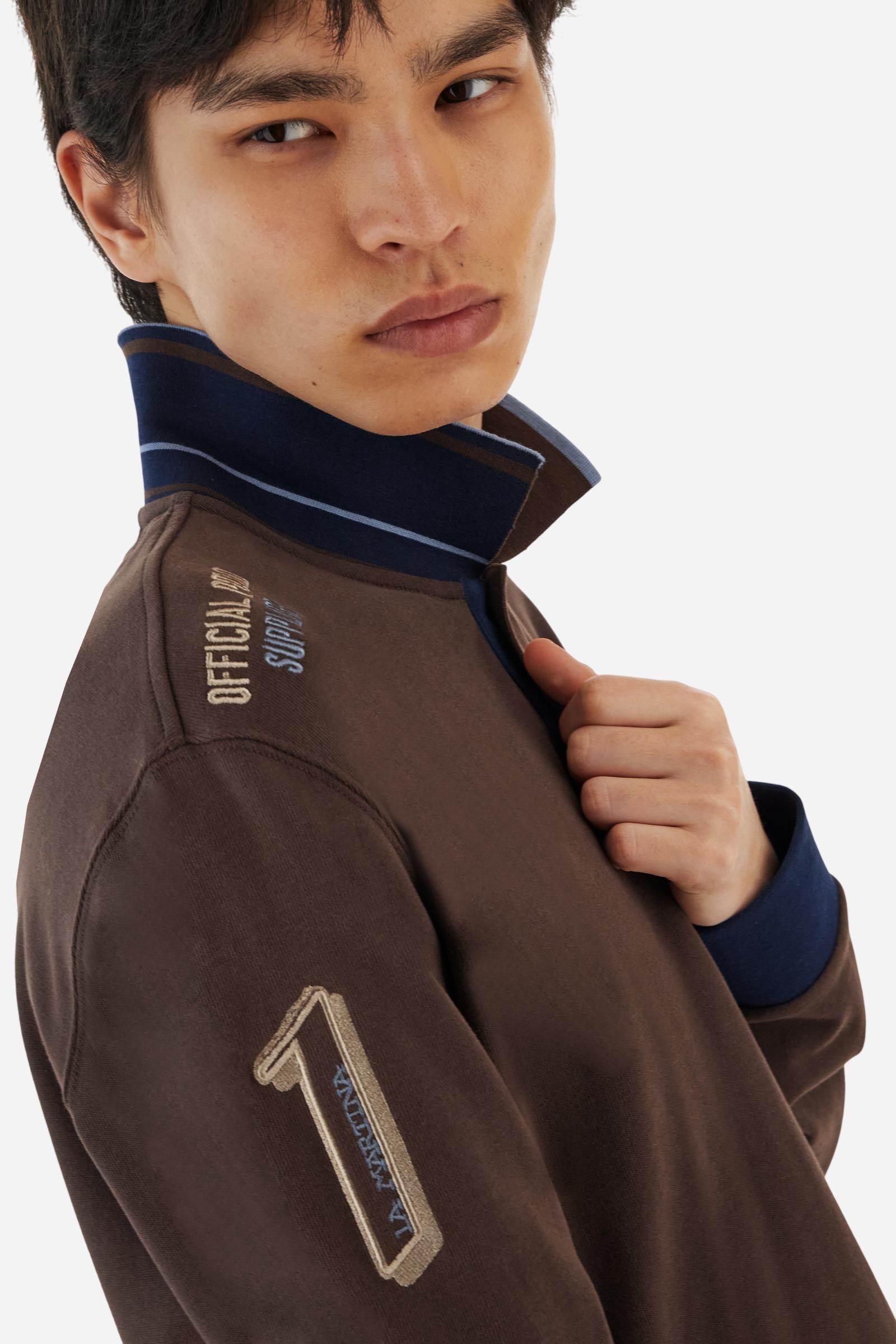 Men’s long-sleeve polo shirt in solid-colour cotton jersey with a warm, matte handfeel. Ribbed collar and cuffs with stripes and colour blocks in contrast, two personalised buttons and contrast details inside the collar. Patches and graphics on sleeves and chest celebrate the Official Polo Supplier team. The large multicolour logo is embroidered on the chest. Regular fit. The model wears size L. - Java