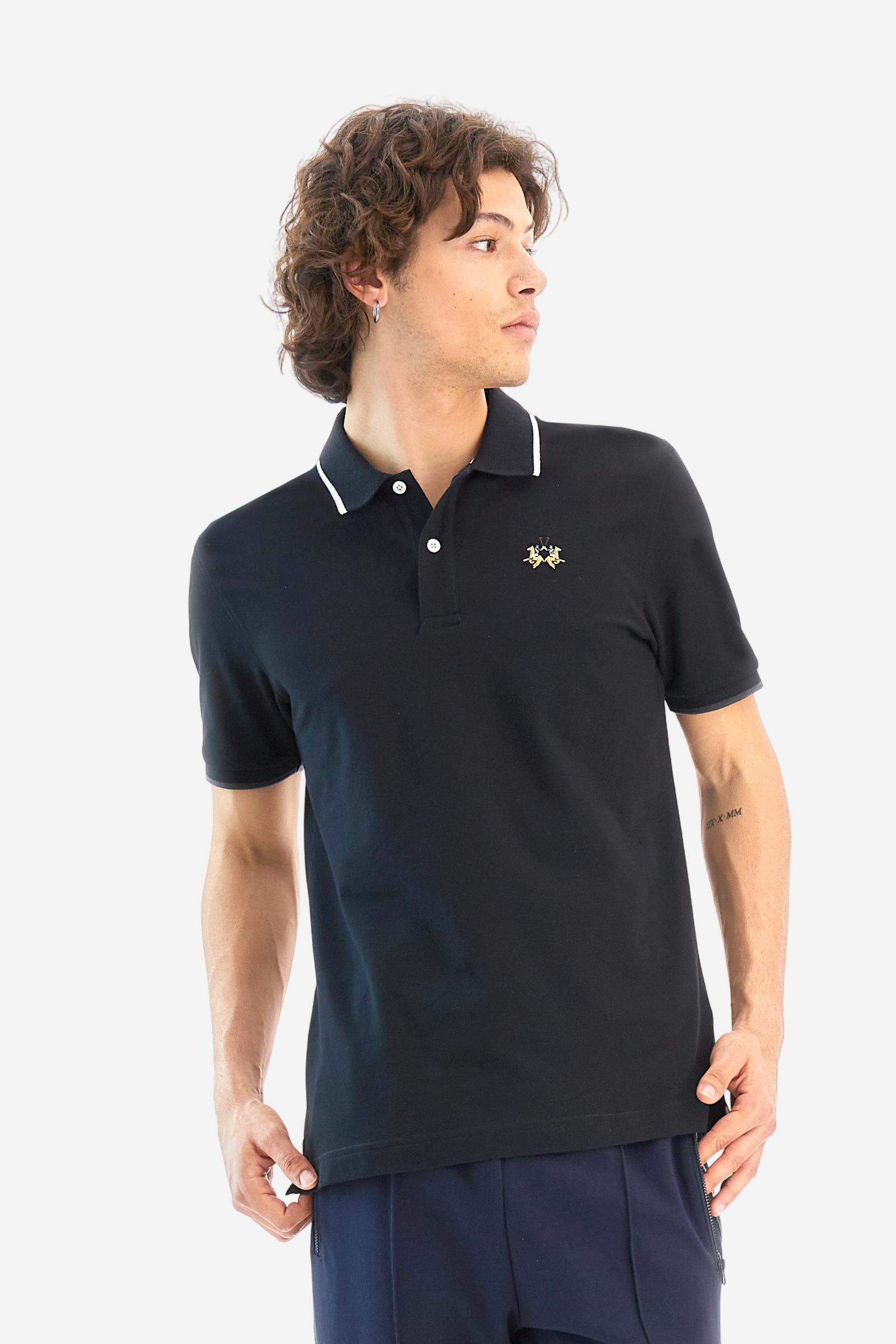 Short-sleeved, single-colour men's polo shirt made of stretch cotton piqué. Fastens with two buttons. The collar and cuffs are ribbed, and there is a colour-contrasting trim at the bottom of the collar. Inside the collar there is a grosgrain ribbon of a different shade. The logo is embroidered on the chest in a contrasting colour. The fit is slim. The model is wearing a size L. - Black