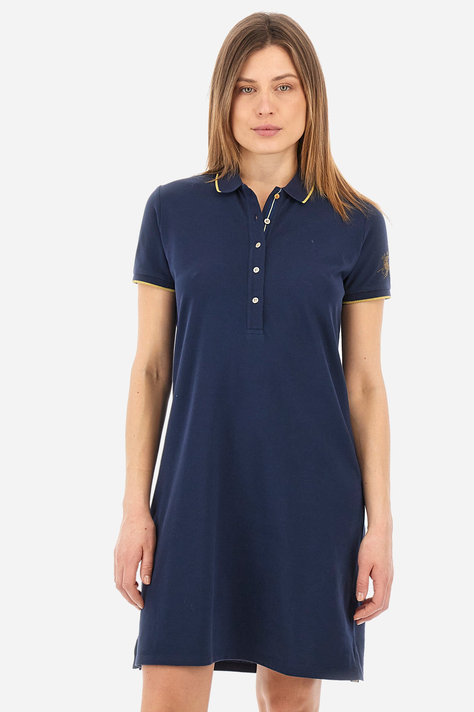 Single-colour short-sleeved dress made of elasticated cotton. Soft, straight cut silhouette, above-the-knee length. With a profiled and ribbed collar and armholes. Collar with contrasting rhinestone writing. With button fastening. The "La Martina" lettering can be found under the collar. A rhinestone logo is applied on one of the sleeves. The fit is regular. The model wears a size 2. - Navy