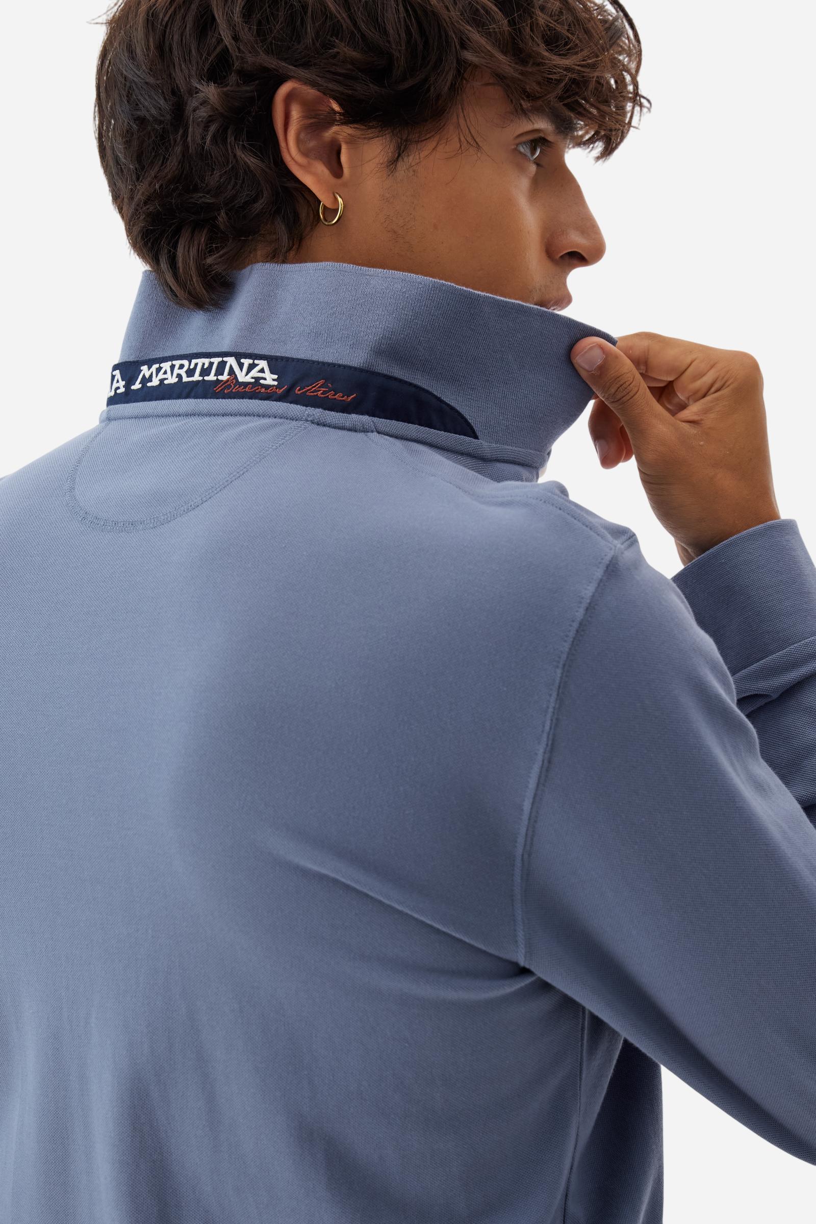 Men’s long-sleeve polo in high-quality stretch cotton piqué for comfort and flexibility. Tone-on-tone ribbed collar with contrast gabardine undercollar embroidered with the brand’s iconic lettering, revealed when the collar is lifted. Contrast embroidered logo on the chest. Slim fit, offering a modern silhouette that enhances the body while ensuring freedom of movement. Model wears size L. - Flint Stone