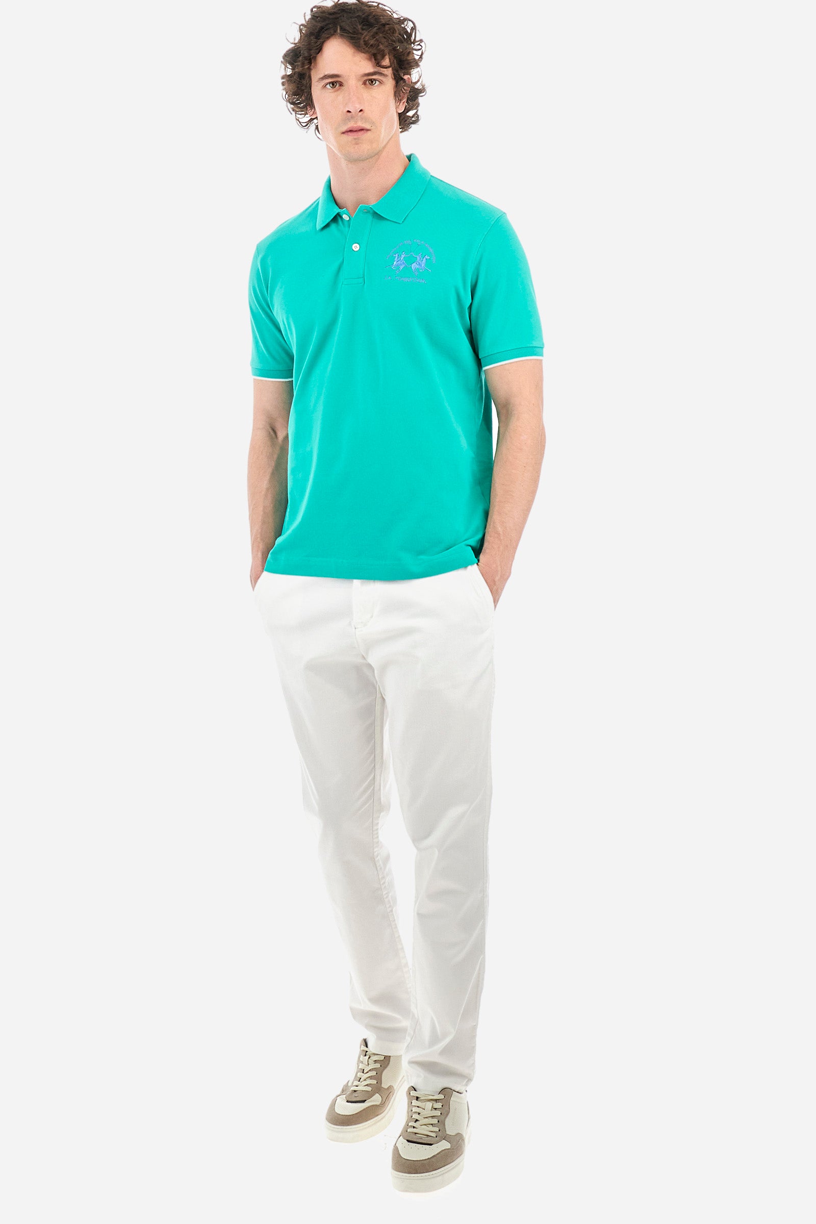 Men’s polo with short sleeves, regular fit. Made of stretch pique cotton. Classic model, with large embroidered logo in contrasting tone on the chest and profiled sleeve edges. The collar is accompanied by the writing La Martina, in contrasting tone. Ideal if worn with a denim collection. The model wears a size L. - Vivid Green