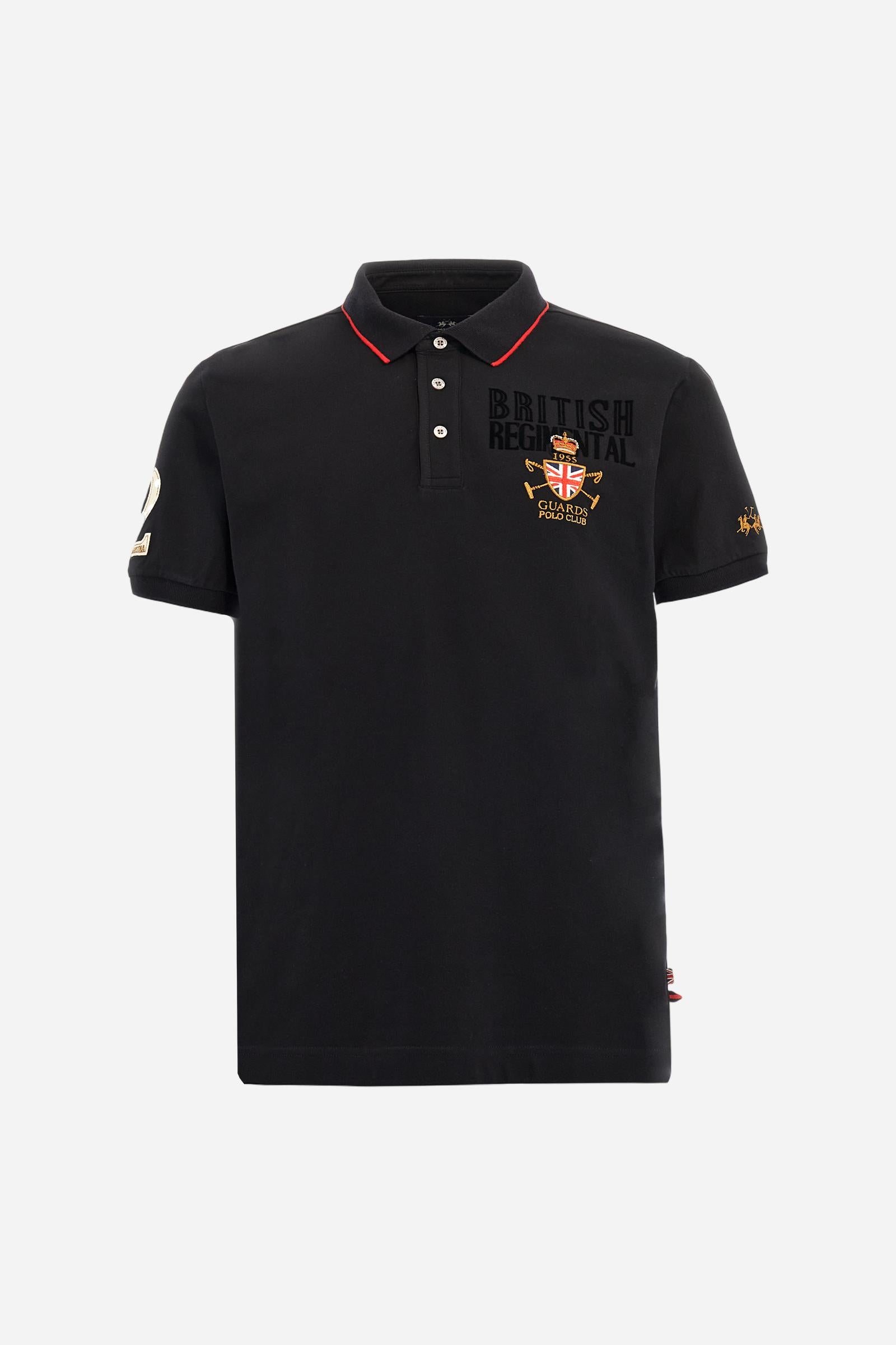 Short-sleeve polo shirt from the Guards capsule, made of high-quality stretch cotton piqué. Ribbed collar and cuffs in matching tone, with contrast striped detail on the collar. Three-button personalized placket. Multicolor graphics, patches, and lettering celebrate the British regiment, applied to chest and sleeves. Brand logo embroidered in contrast on the left sleeve. Regular straight fit. Model wears size L. - Black