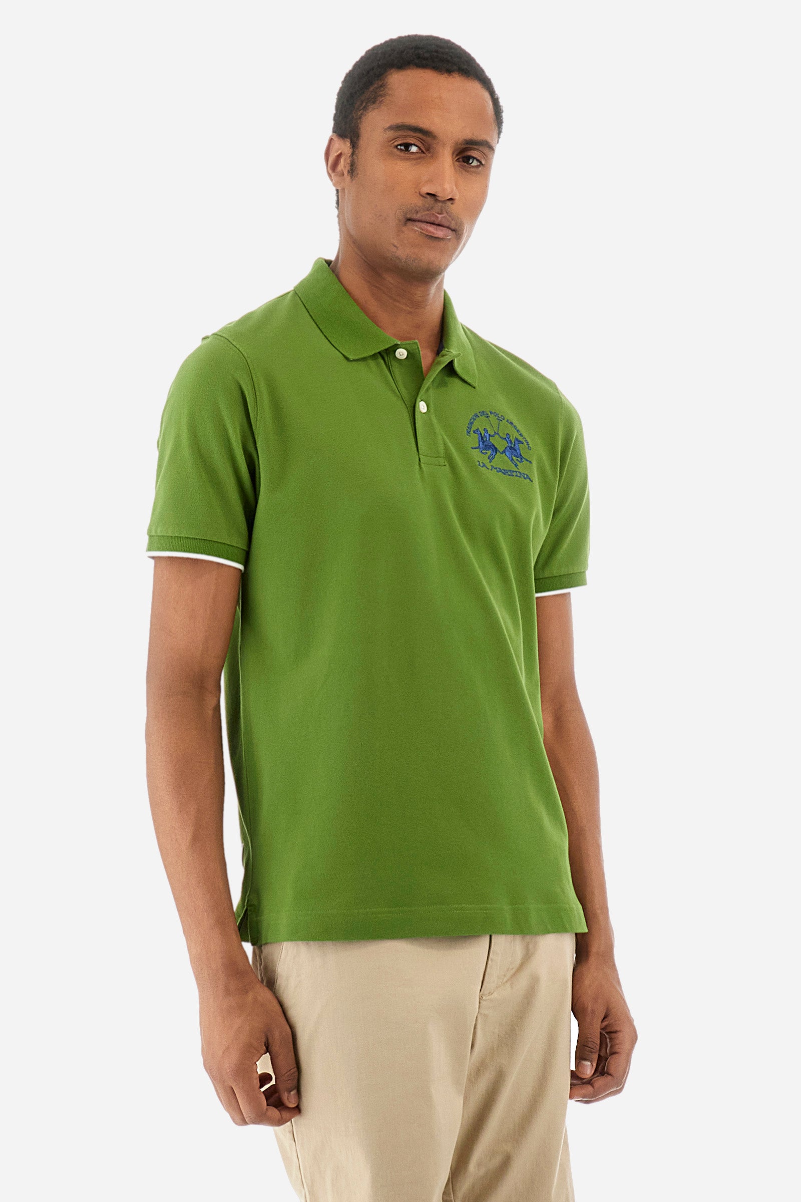 Men’s polo with short sleeves, regular fit. Made of stretch pique cotton. Classic model, with large embroidered logo in contrasting tone on the chest and profiled sleeve edges. The collar is accompanied by the writing La Martina, in contrasting tone. Ideal if worn with a denim collection. The model wears a size L. - Cactus