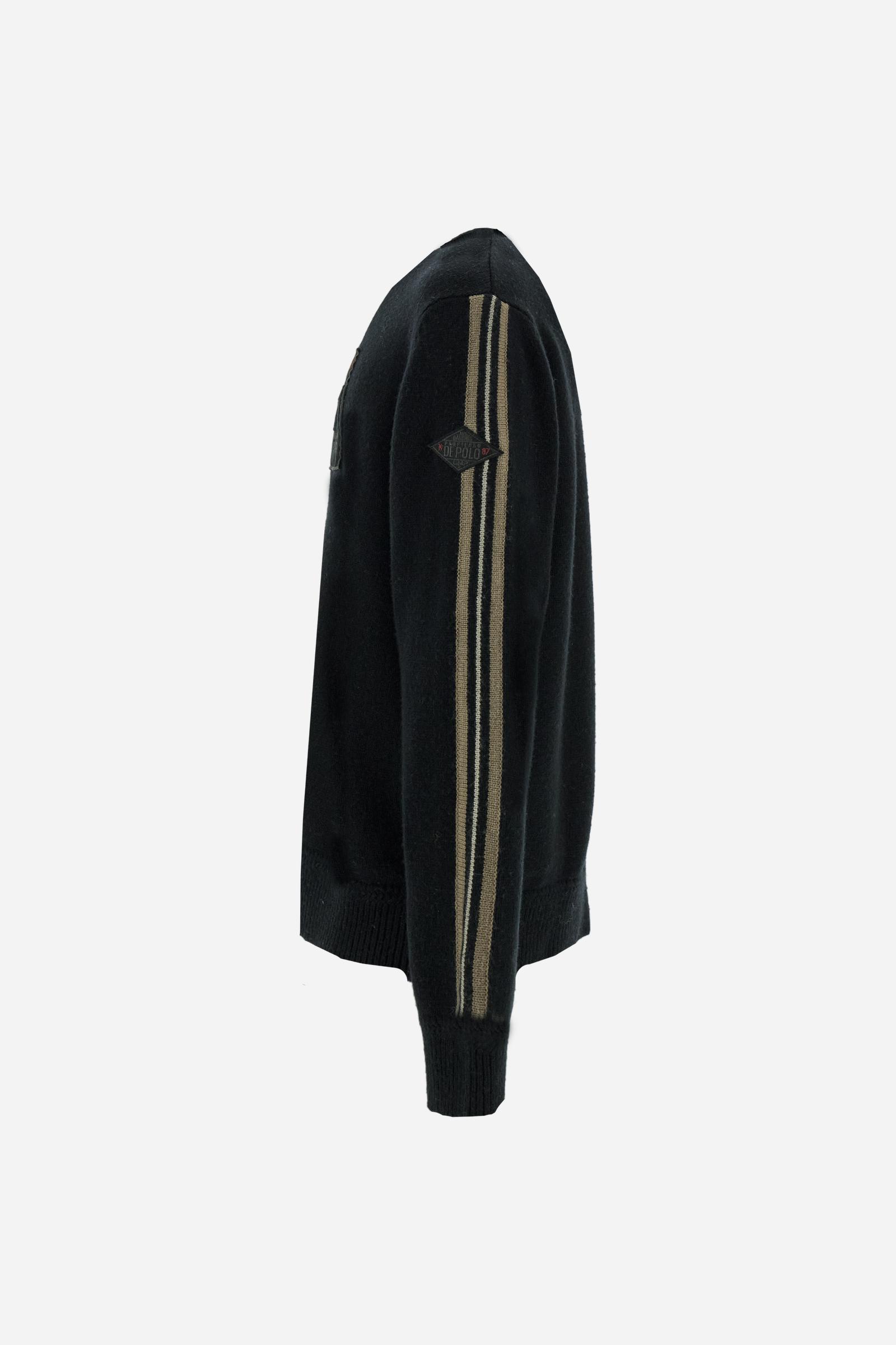 Full-zip men’s sweater in lambswool blend, soft and resistant. Ribbed collar, cuffs, and hem in matching tone. Multicolor striped knitted bands run along the sleeves. A large embroidered patch dedicated to Argentina dominates the chest, complemented by additional embroidered patches on the left sleeve. Relaxed, comfortable fit for distinctive everyday style. Model wears size L. - Black