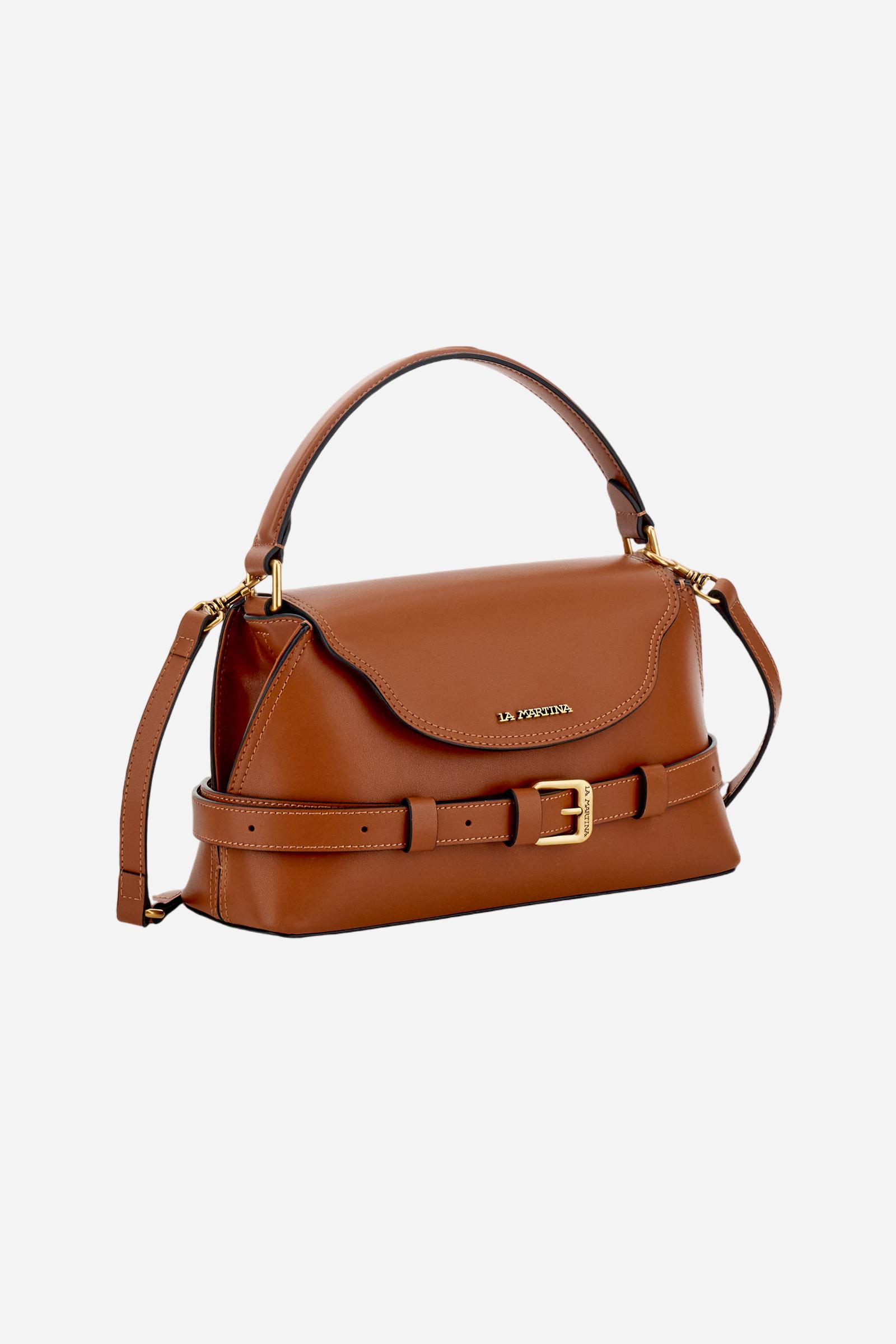 Small trapeze tote bag in calfskin leather. Refined and compact, with flap, rigid handle and removable strap. - COGNAC