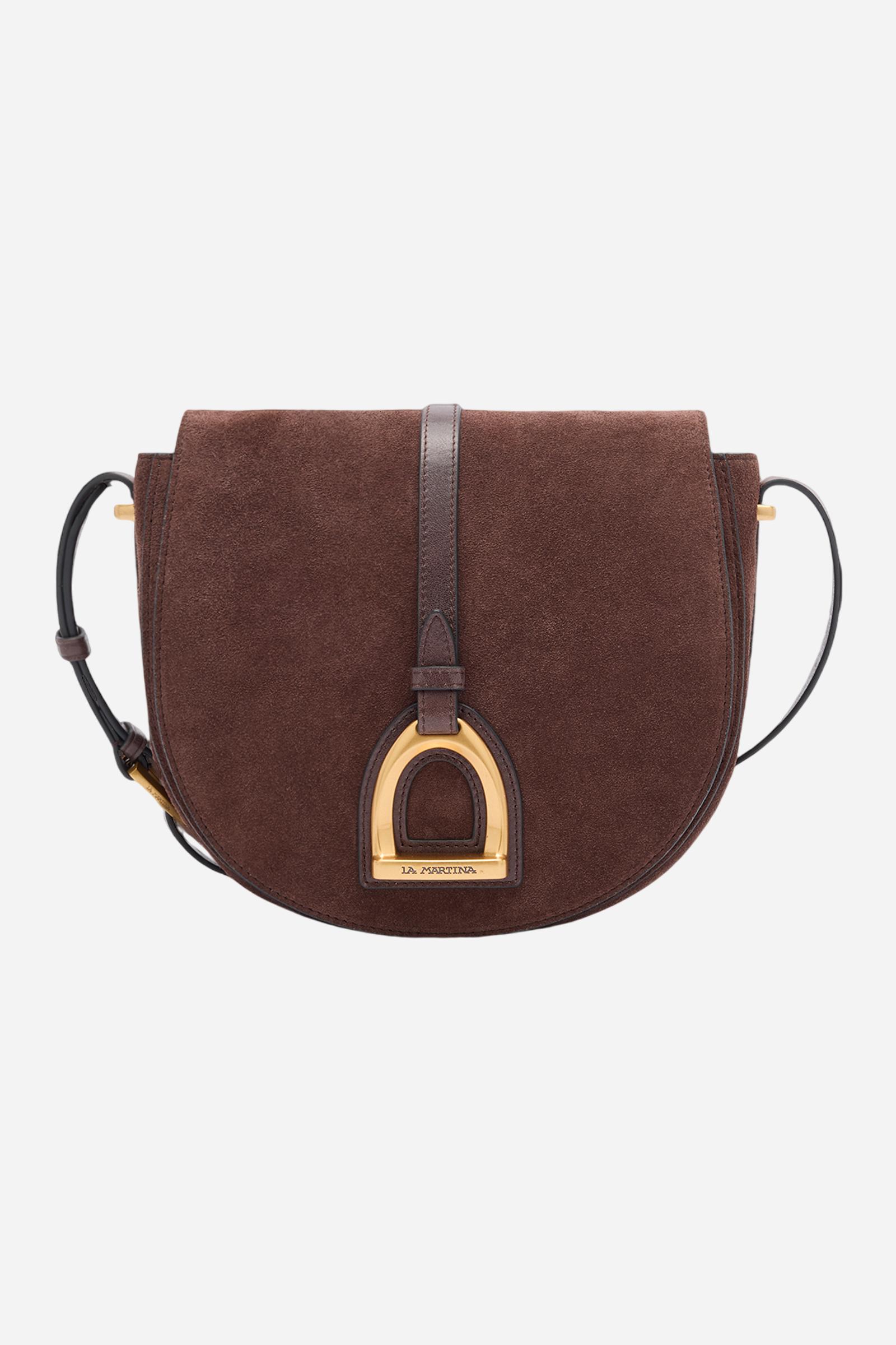 Crossbody bag in suede with leather details, with curved and refined design. The front flap, closed with a hidden magnet, is decorated with a large golden logo buckle and contrasting leather details. The adjustable strap is made of leather. Dimensions:19 x 16 x 6 - D.BROWN/D.CHOCOLATE