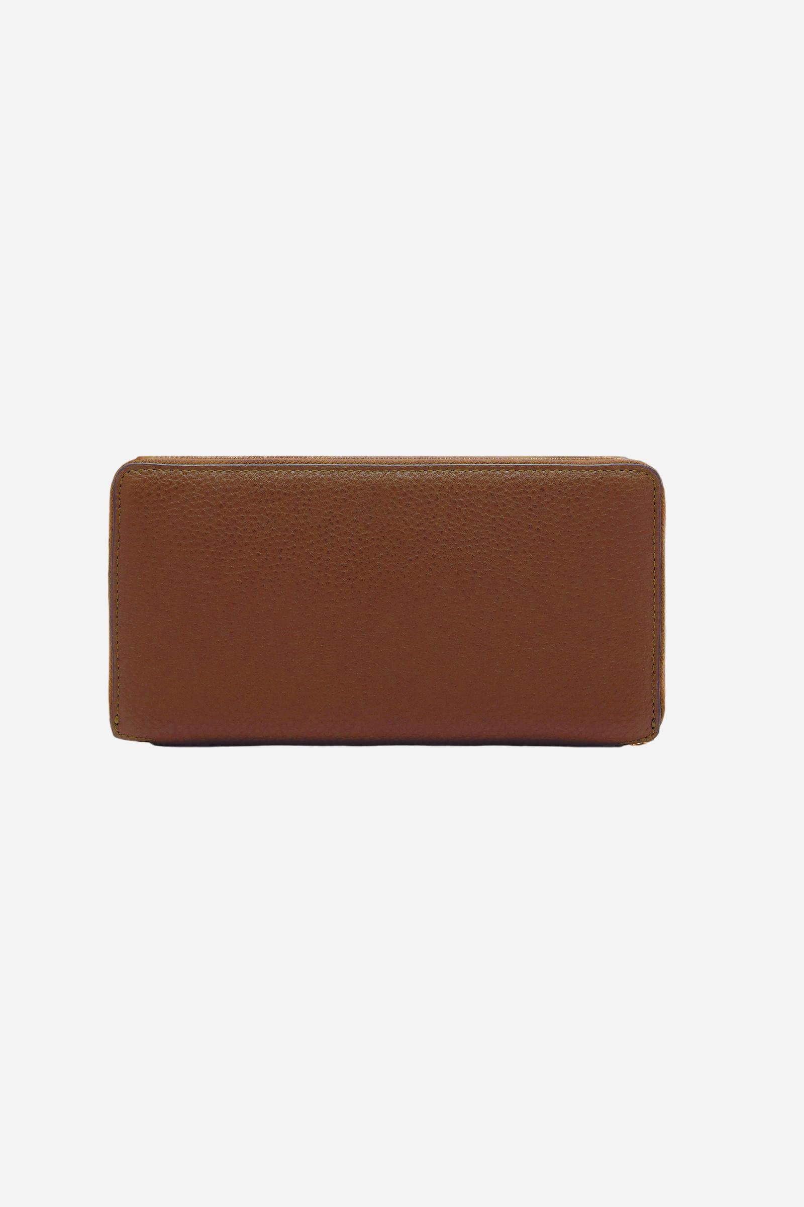 Rectangular zip-around wallet crafted from soft full-grain leather. Features practical interior compartments and a gold-tone all-around zip. Finished with a small metallic detail engraved with the brand’s logo. - COGNAC