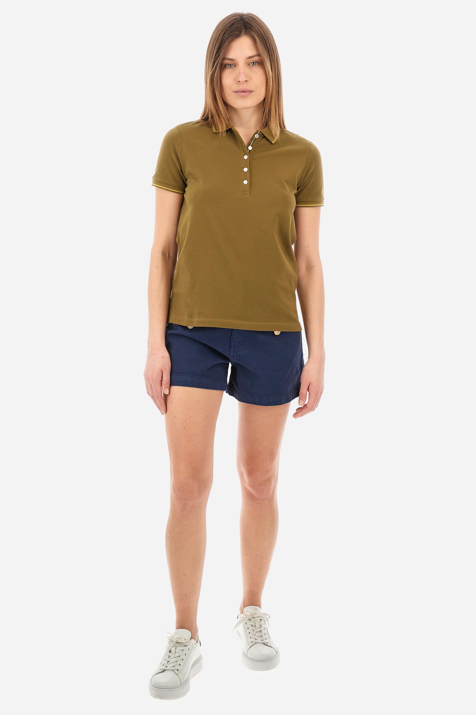 Women’s polo with short sleeves in solid color, made of stretch cotton. 5-button closure. Collar and crew sleeves profiled and ribbed. Side slits. Under the collar there is the inscription "La Martina". The logo is embroidered on a sleeve and embellished with the application of some rhinestones. The fit is regular. The model wears a size 2. - Military Olive