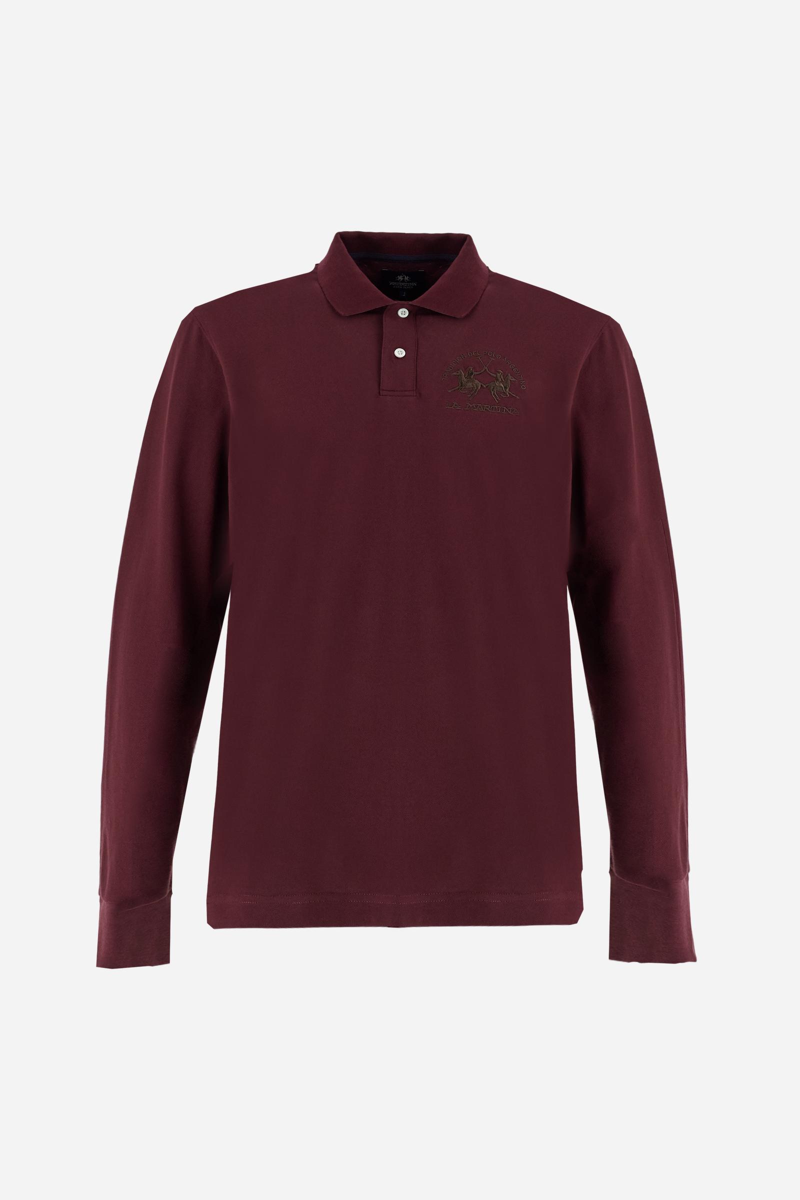 Men's long-sleeved solid colour polo shirt. Made of high-quality stretch Piqué. The collar and cuffs are in solid colour ribbing. The undercollar features a print of the iconic La Martina lettering in a contrasting colour. Featuring a logo embroidered on the chest in a contrasting colour. On the back at the bottom, the guarantee label typical of the brand's iconic models is applied. Regular fit. The model is wearing a size L. - Port Royale