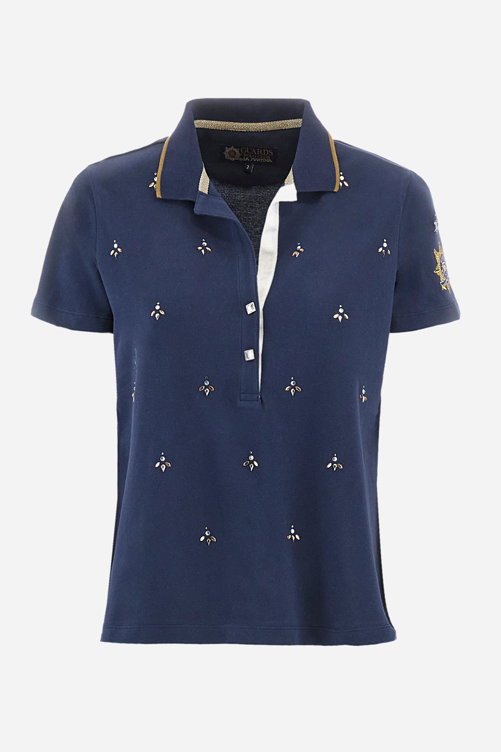 Women’s polo with short sleeves in solid color from the Guards line. Made of stretch cotton. V-neck and 2-button jewel closure. Ribbed collar. Side slits. Rhinestones of various shapes, sizes and colors were applied to the front. The logo and the characteristic symbol of the line are embroidered on a sleeve. The fit is regular. The model wears a size 2 . - Navy