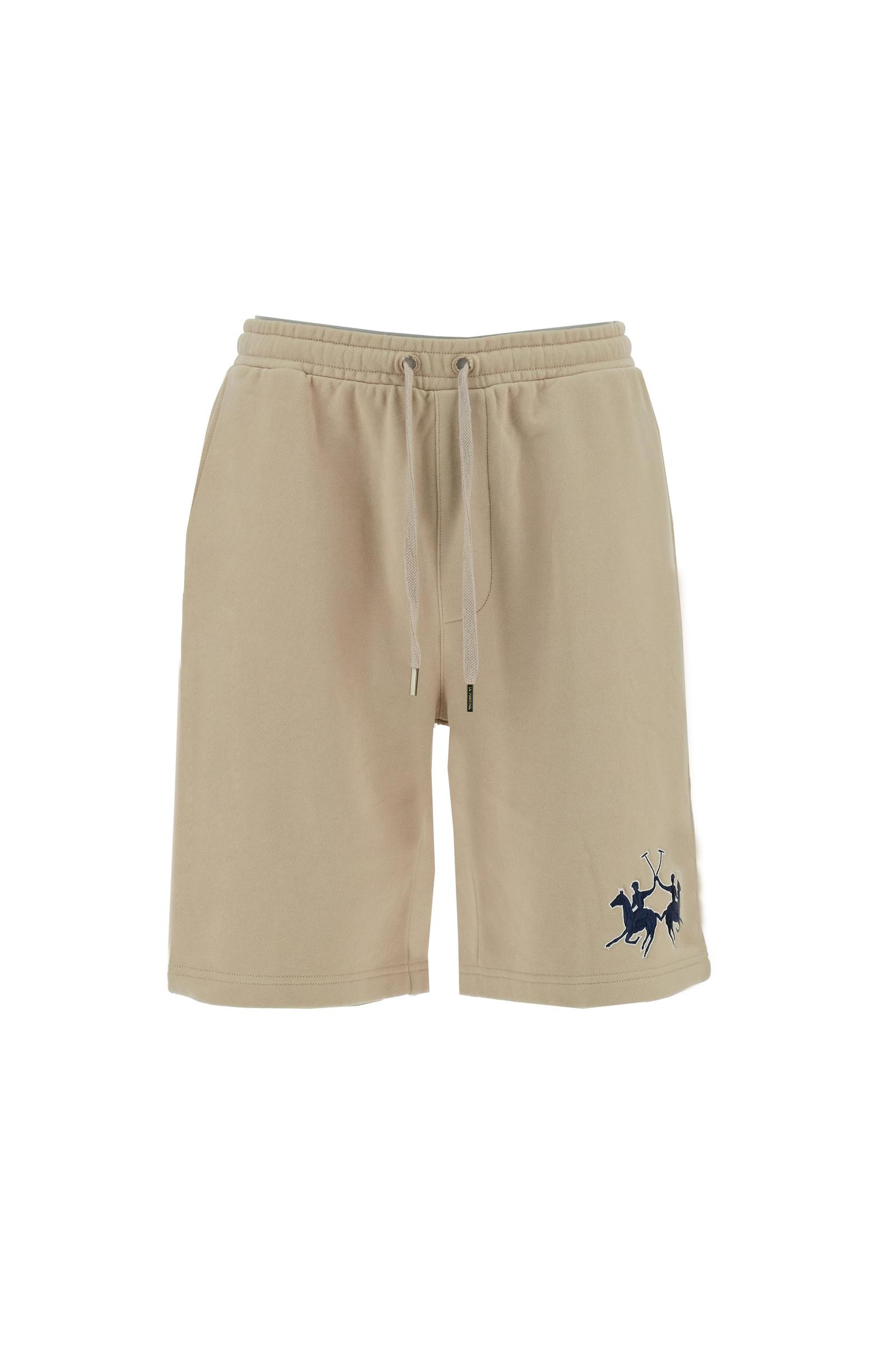 Men's bermuda shorts made from soft 100% cotton diagonal fleece. The regular relaxed cut reaches the knee and ensures maximum freedom of movement. The elastic waistband is completed by a flat tone-on-tone drawstring for adjustment. The design is finished with the brand's maxi logo embroidered in contrasting color with a 3D effect on the lower left leg. The model is wearing size L. - Humus