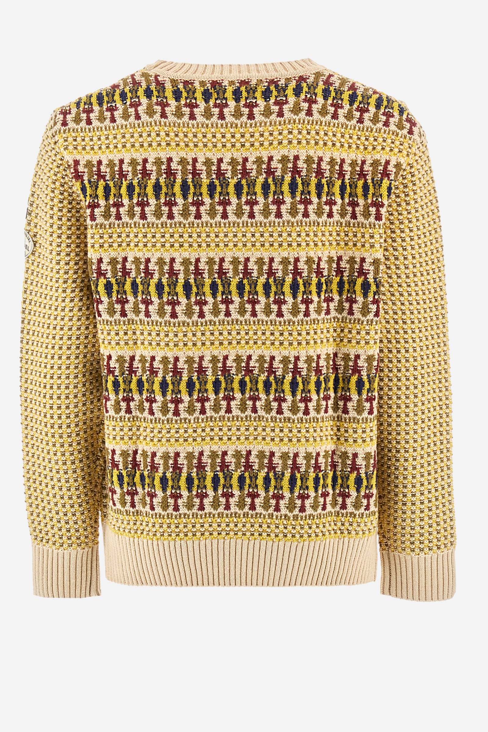 Men's crewneck pullover with long sleeves, made from a wool-blend yarn. The jacquard pattern differs on the front and sleeves, featuring a micro-check effect, while the back showcases a larger pattern with horizontal blocks. The collar, hem, and cuffs are in solid ribbed fabric. A patch inspired by Tierra del Fuego and a rubberized logo patch are applied on the sleeve. The fit is comfortable. - Jacquard Multicolour