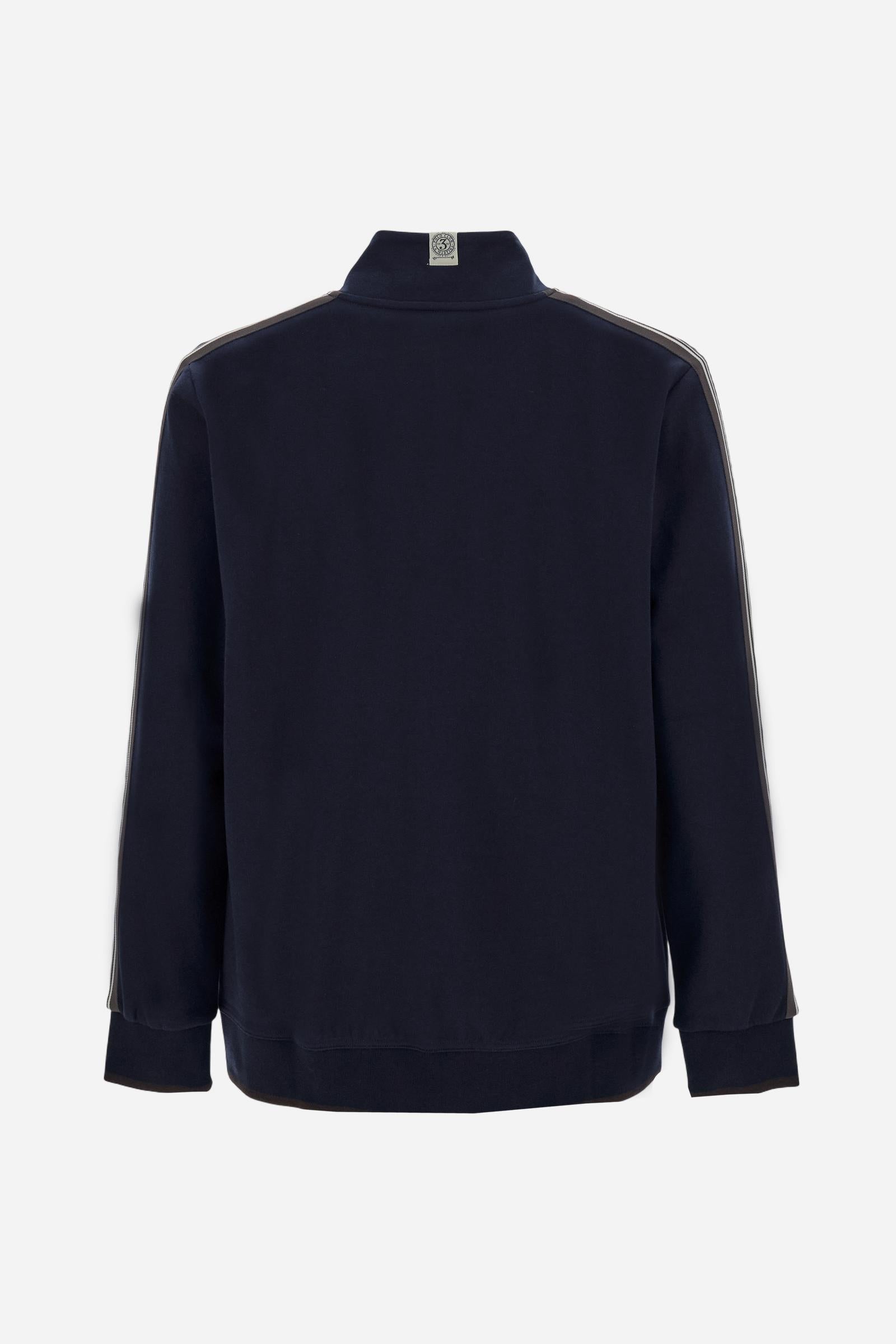 Men's long-sleeved, full-zip sweatshirt. Made of soft solid colour cotton fleece. The neck and cuffs and waistband are in solid colour ribbed knit with contrasting edging. Front zip opening and Polo club guarantee label applied to the edge inside the collar. The front lettering is a large tone-on-tone raised embroidery. A narrow two-tone striped band is applied to the shoulders and sleeves. Regular fit. The model is wearing a size L. - Navy