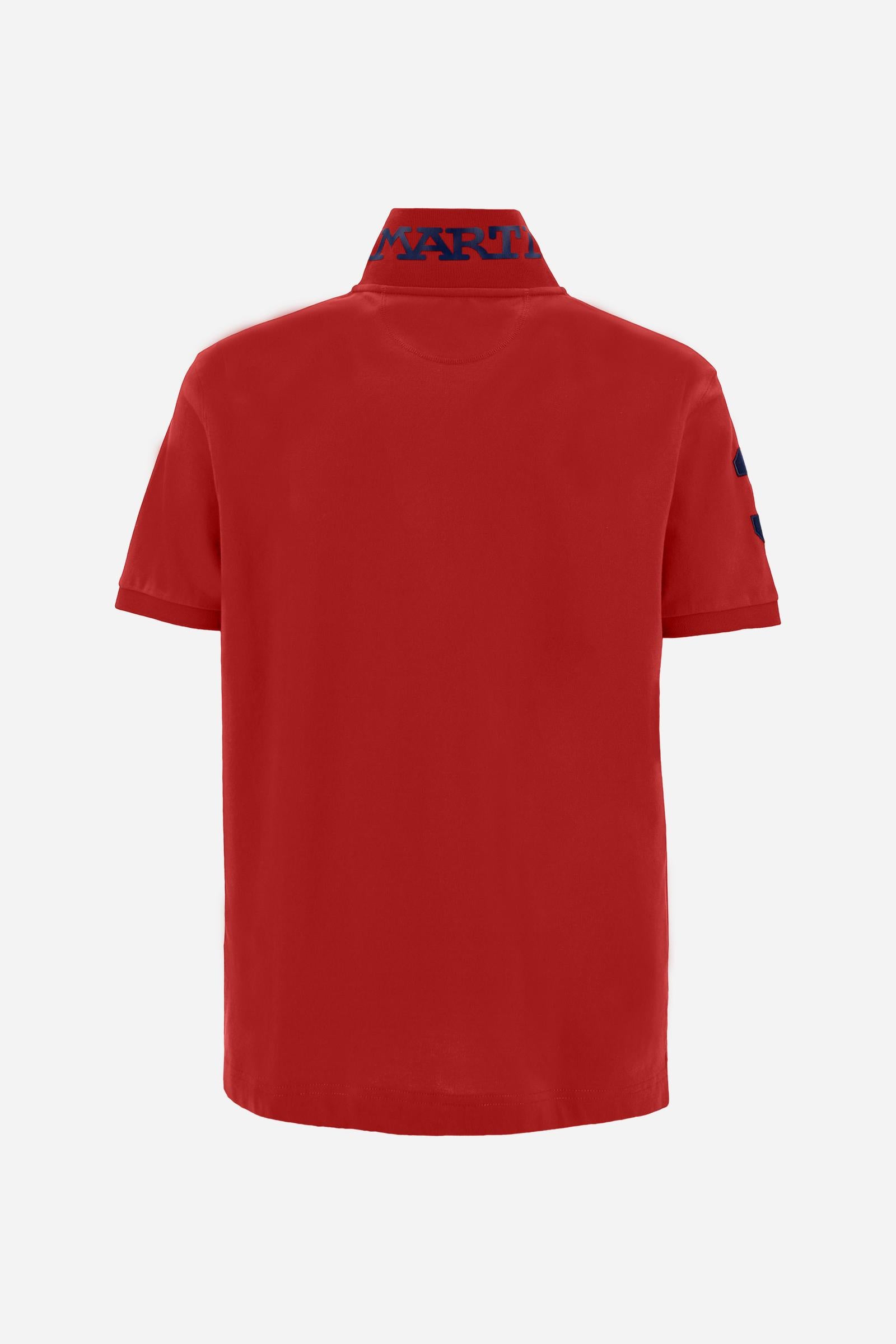 Men’s short-sleeve stretch piqué polo. Two-button placket and ribbed details, with a regular fit. Iconic style characterised by applied logo and patches. - Formula One