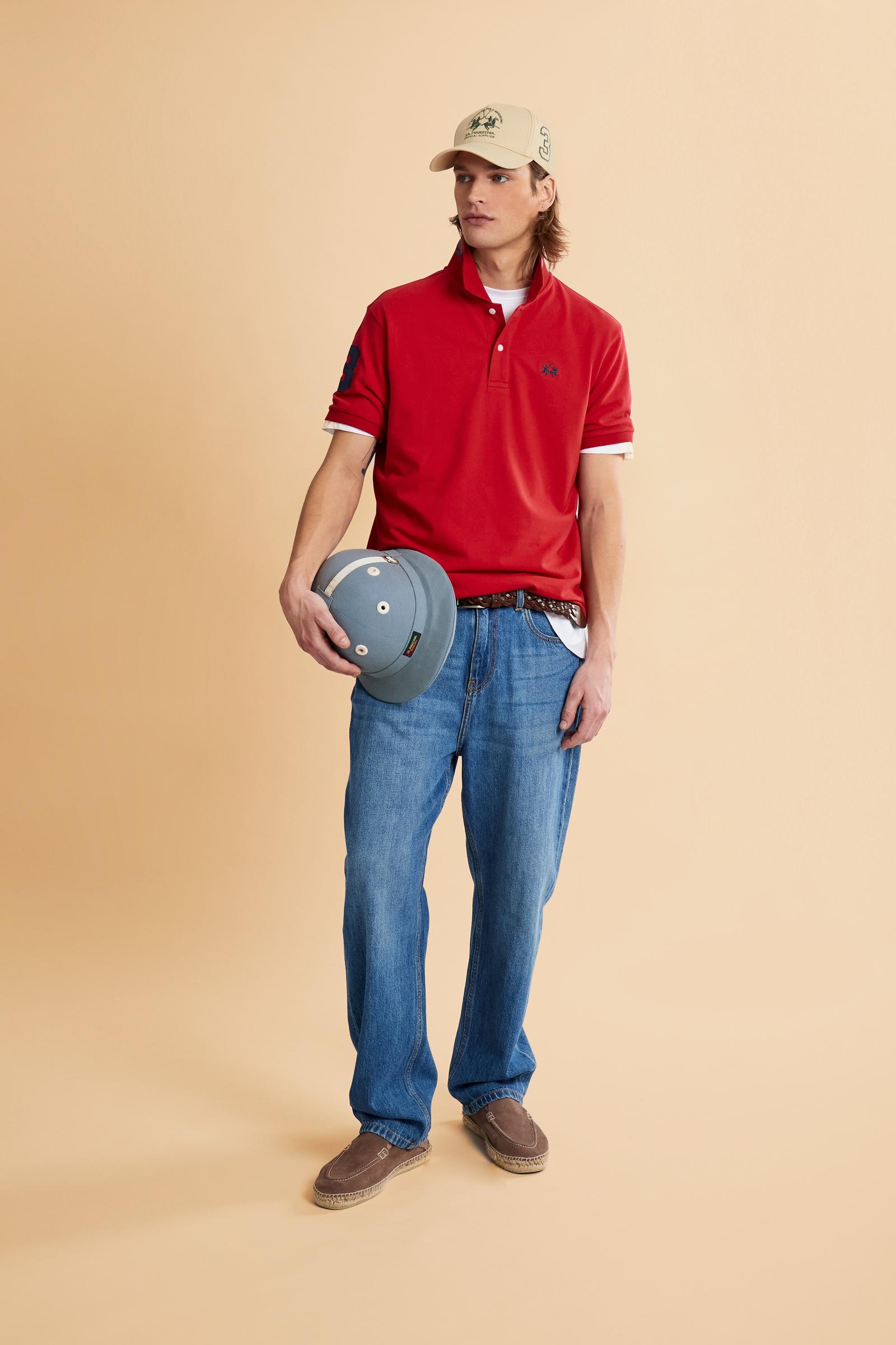 Men’s short-sleeve stretch piqué polo. Two-button placket and ribbed details, with a regular fit. Iconic style characterised by applied logo and patches. - Formula One