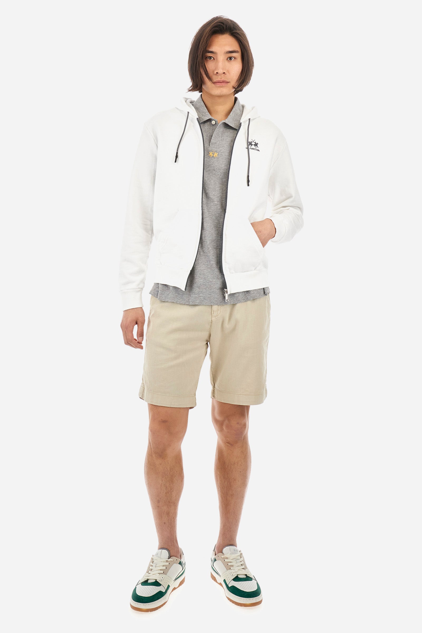 This is the iconic Polo 19-42 from La Martina. Men's short-sleeved polo shirt in solid color made of 100% slub jersey. With a regular fit, it has a collar and a double button closure while the La Martina logo is embroidered in small gold on the front under the placket. Ideal when worn with denim from the collection. Each Polo is kept in an exclusive logoed envelope and is accompanied by a certificate of guarantee. The model is 187 cm tall and wears a size L. - Light Heather Grey