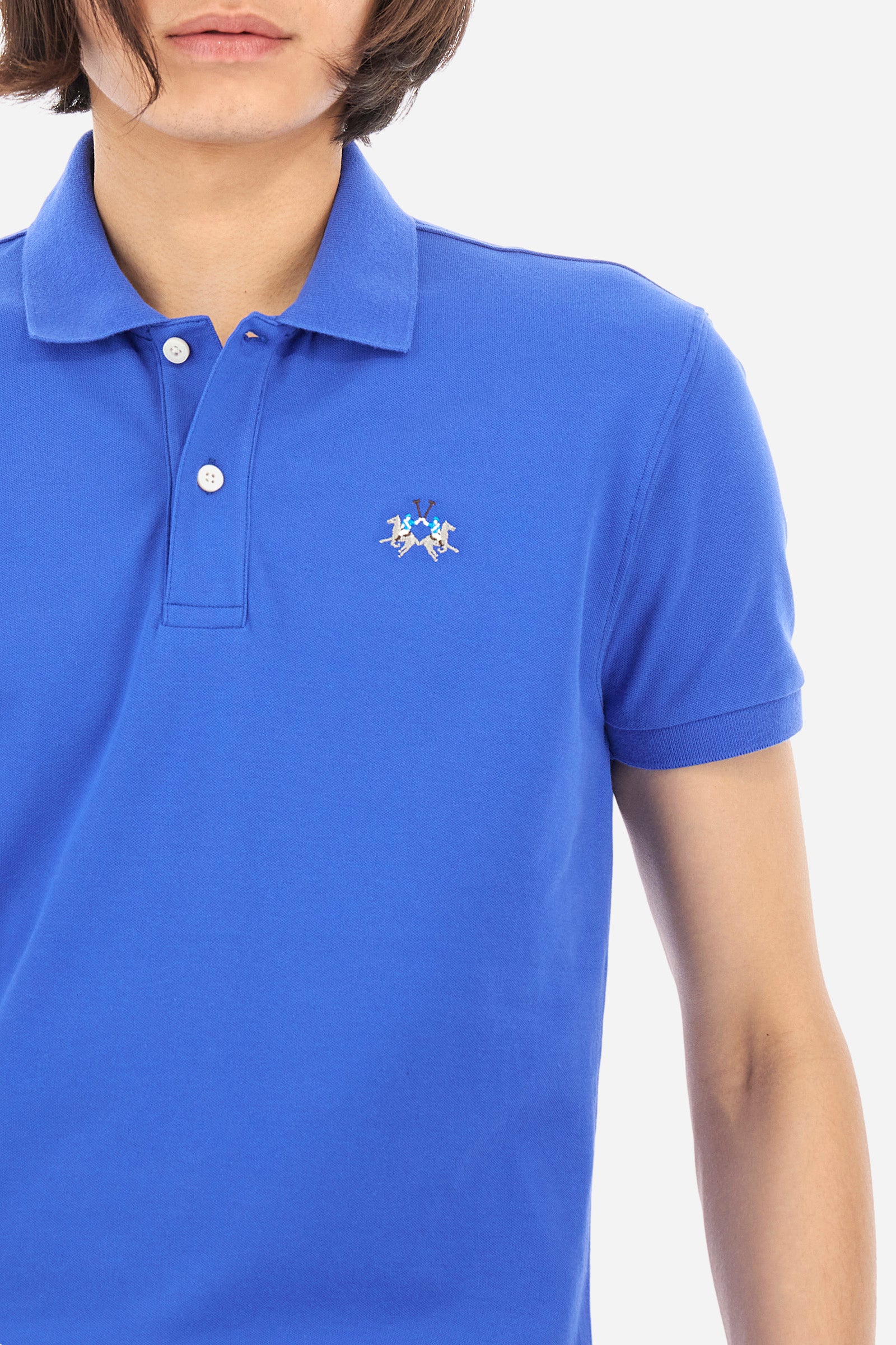 Men's short-sleeved, slim-fit polo shirt. A classic model with a contrasting embroidered La Martina logo-embellished chest. Perfect when worn with a pair of jeans from the collection. - Dazzling Blue