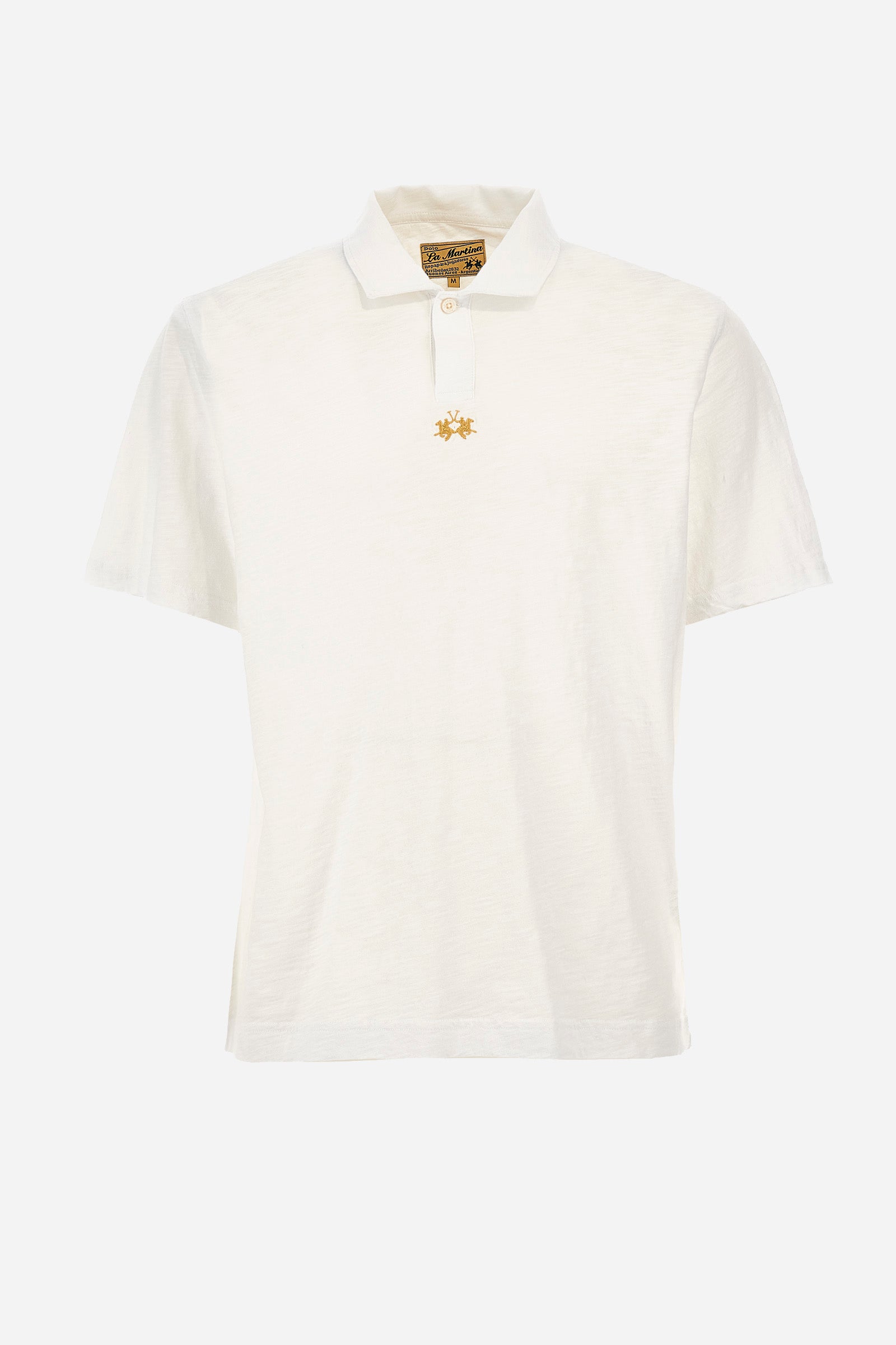 This is the iconic Polo 19-42 from La Martina. Men's short-sleeved polo shirt in solid color made of 100% slub jersey. With a regular fit, it has a collar and a double button closure while the La Martina logo is embroidered in small gold on the front under the placket. Ideal when worn with denim from the collection. Each Polo is kept in an exclusive logoed envelope and is accompanied by a certificate of guarantee. The model is 187 cm tall and wears a size L. - Optic White