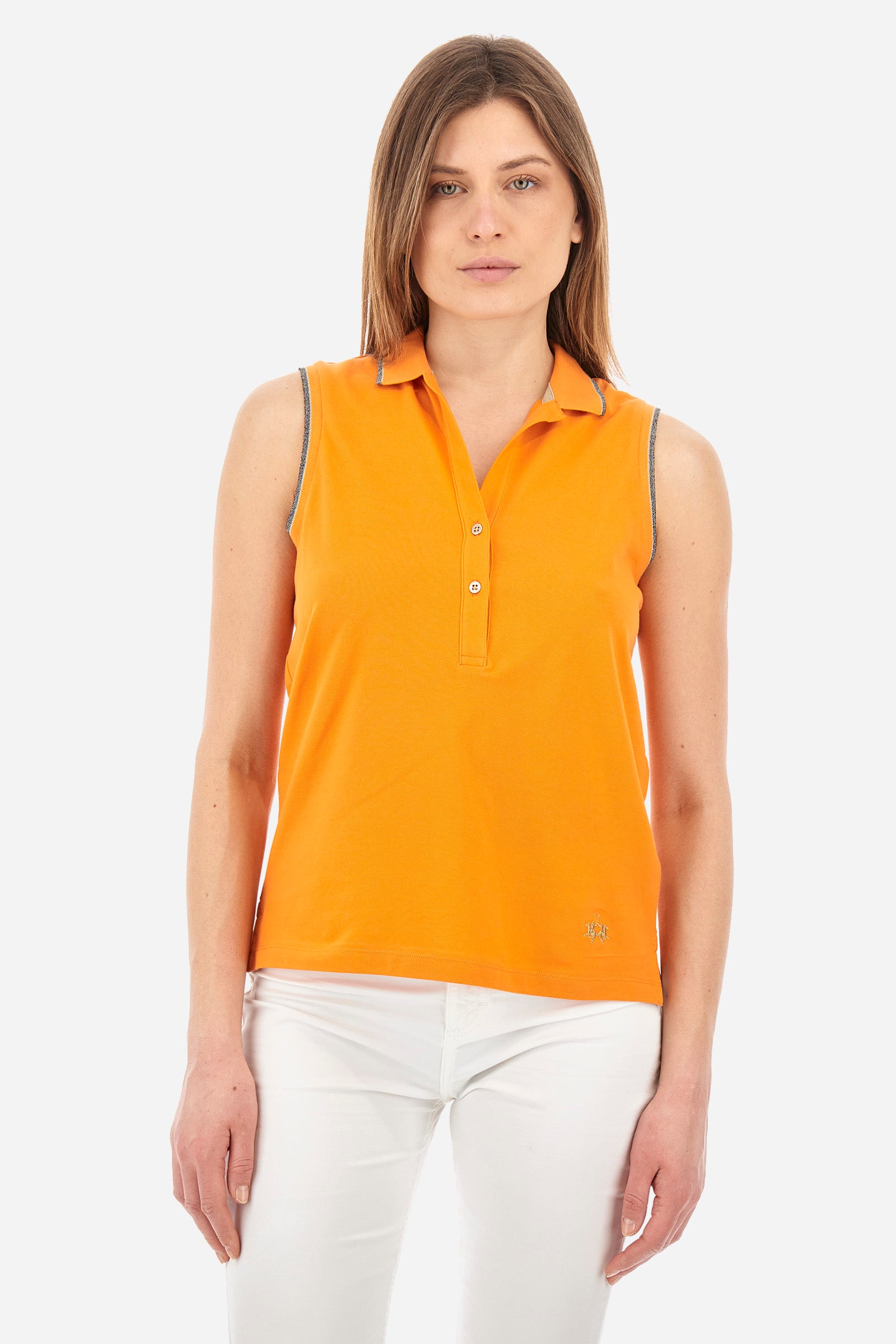 Women’s sleeveless polo shirt in solid color, made of stretch cotton. V-neck and 2 button closure. Collar and crew sleeves profiled and ribbed. Side slits. On the back there is the inscription "La Martina" composed of small rhinestones. The logo is present on the front. The fit is regular. The model wears a size 2 . - Celosia Orange