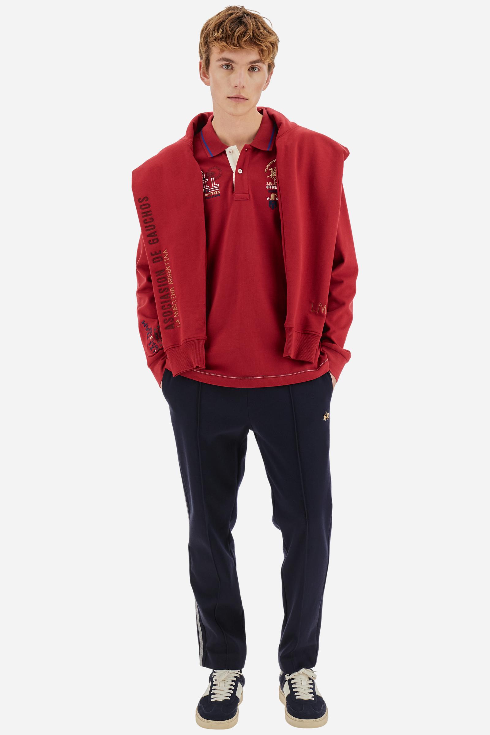 Men’s long‑sleeve polo in warm soft‑touch cotton jersey. Regular fit, contrast collar and graphics celebrating Snow Polo. - Chili Pepper