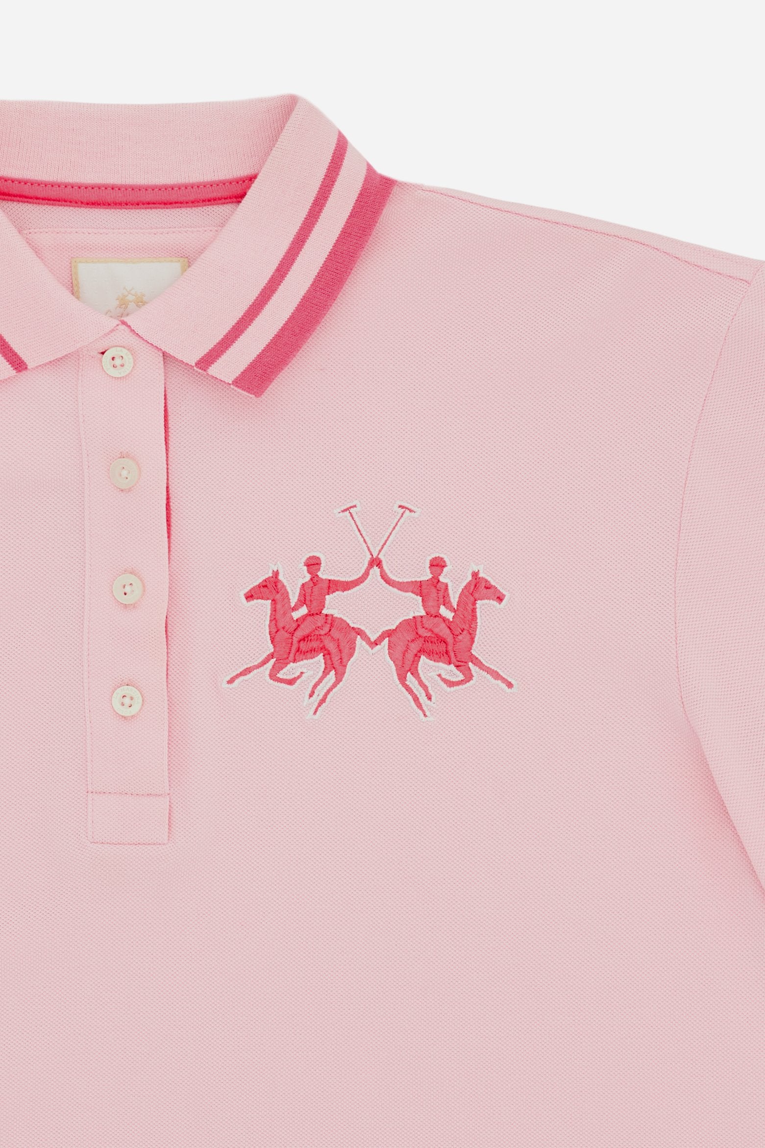 Women's short-sleeve polo shirt made from 100% cotton piqué fabric in solid color. The model features a front opening with customized buttons and a contrasting inner placket. The ribbed collar is two-tone with a striped detail creating a positive/negative color effect between the upper and lower parts. The modern fit features a slightly boxy cropped cut. The chest is decorated with a maxi 3D embroidered logo in contrasting color. The model is wearing size 2. - FairTale