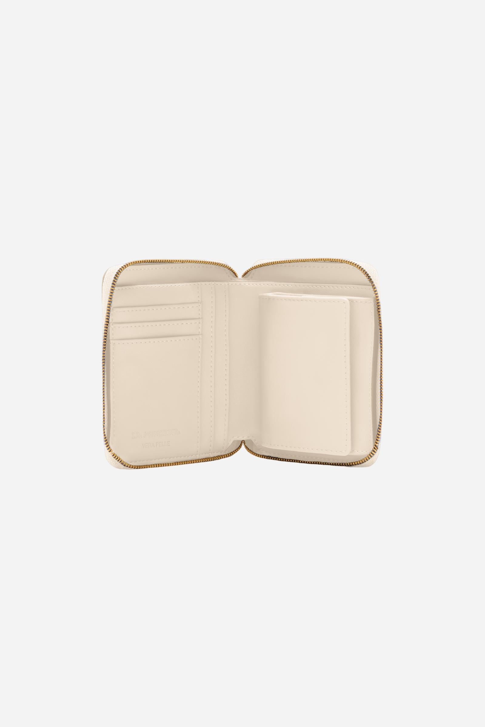 Small zip around wallet in calfskin leather. Compact and practical, with golden zip and branded metal detail. - SILK