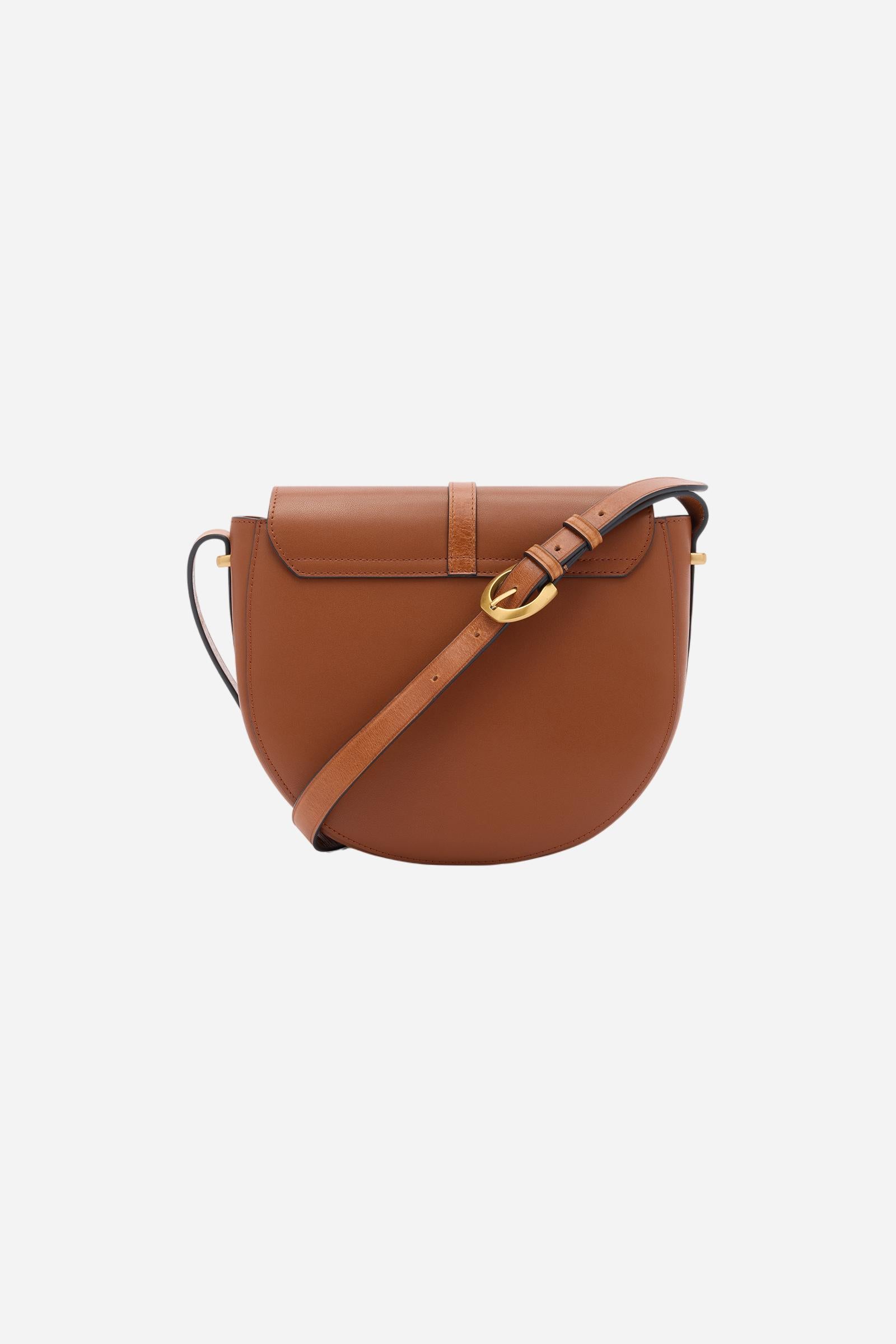 Small crossbody bag in calfskin leather and leather. Curved design with large golden buckle and contrasting details. - COGNAC/LEATHER