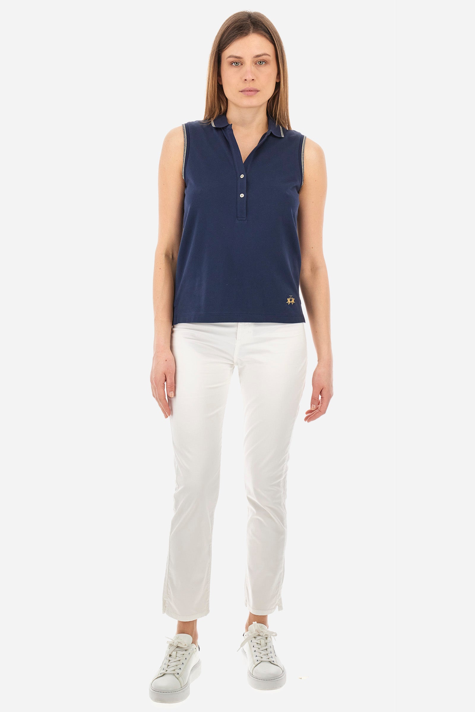 Women’s sleeveless polo shirt in solid color, made of stretch cotton. V-neck and 2 button closure. Collar and crew sleeves profiled and ribbed. Side slits. On the back there is the inscription "La Martina" composed of small rhinestones. The logo is present on the front. The fit is regular. The model wears a size 2 . - Navy