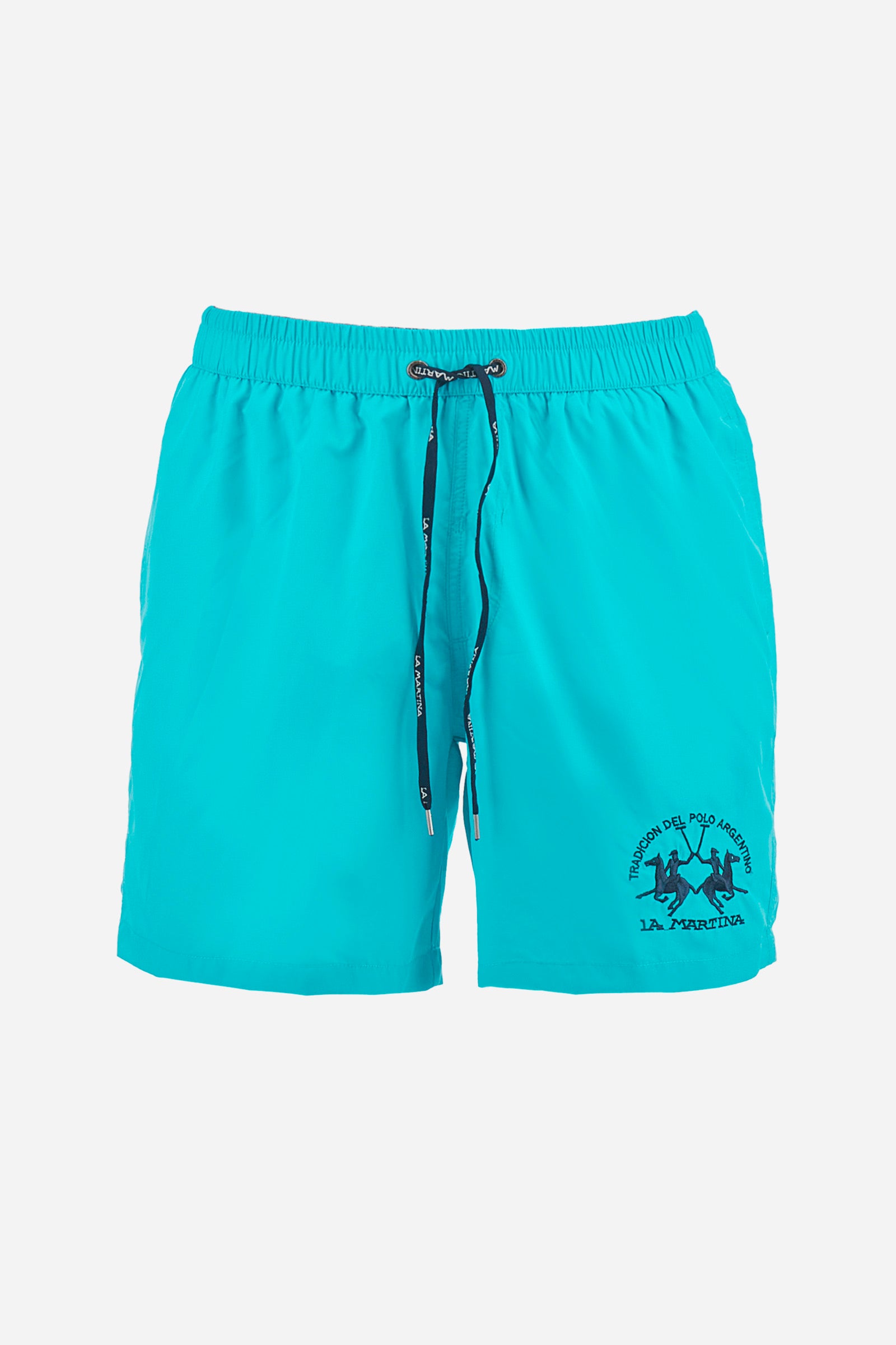 Plain men's swimming shorts made of nylon. Elastic waistband with a personalised drawstring for waist adjustment. On the inside of the shorts is an elasticated mesh brief. Double side pocket on the hips and patch pocket with flap on the back, on the right side only. The large logo is embroidered in a contrasting colour thread on the bottom of the left leg on the front. Regular fit. The model is wearing a size L. - Blue Atoll