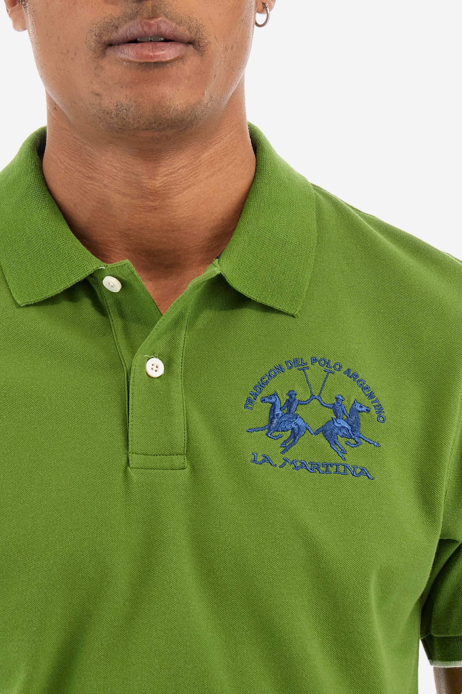 Men’s polo with short sleeves, regular fit. Made of stretch pique cotton. Classic model, with large embroidered logo in contrasting tone on the chest and profiled sleeve edges. The collar is accompanied by the writing La Martina, in contrasting tone. Ideal if worn with a denim collection. The model wears a size L. - Cactus