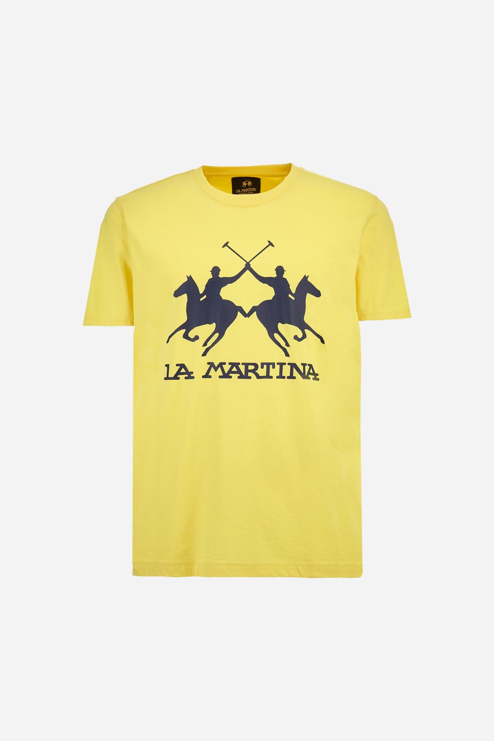 Men's short-sleeved T-shirt with crew neck and solid colour. It features a large printed logo on the front and is made of 100% cotton with a regular fit. It can be combined with trousers for a casual and modern look. The model is 187 cm tall and wears a size L. - Aurora