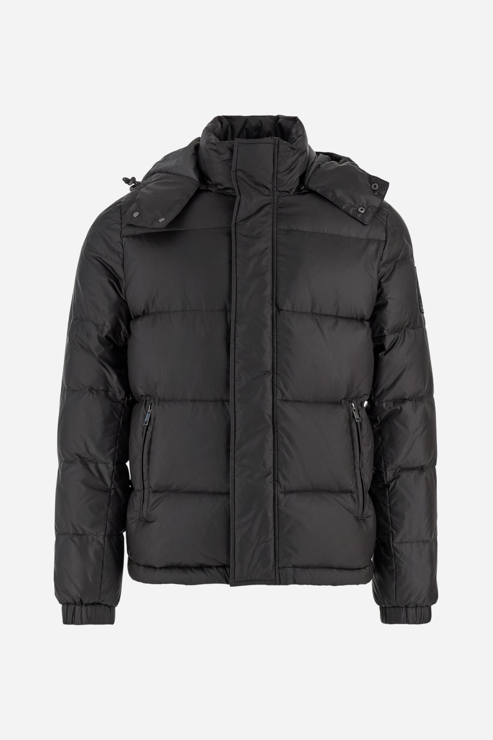 Men’s padded bomber jacket with detachable hood. Made of solid iridescent nylon with contrast lining. Equipped with two practical inner braces for extra comfort. Double customized zip front closure with inner placket featuring contrast Polo Player print, closed with metal snap buttons. Two vertical zipped pockets on the front. Hood with contrast lining and adjustable elastic drawstring. Bold Polo Player graphics printed inside. Regular fit for comfortable movement without bulk. Model wears size L. - Black