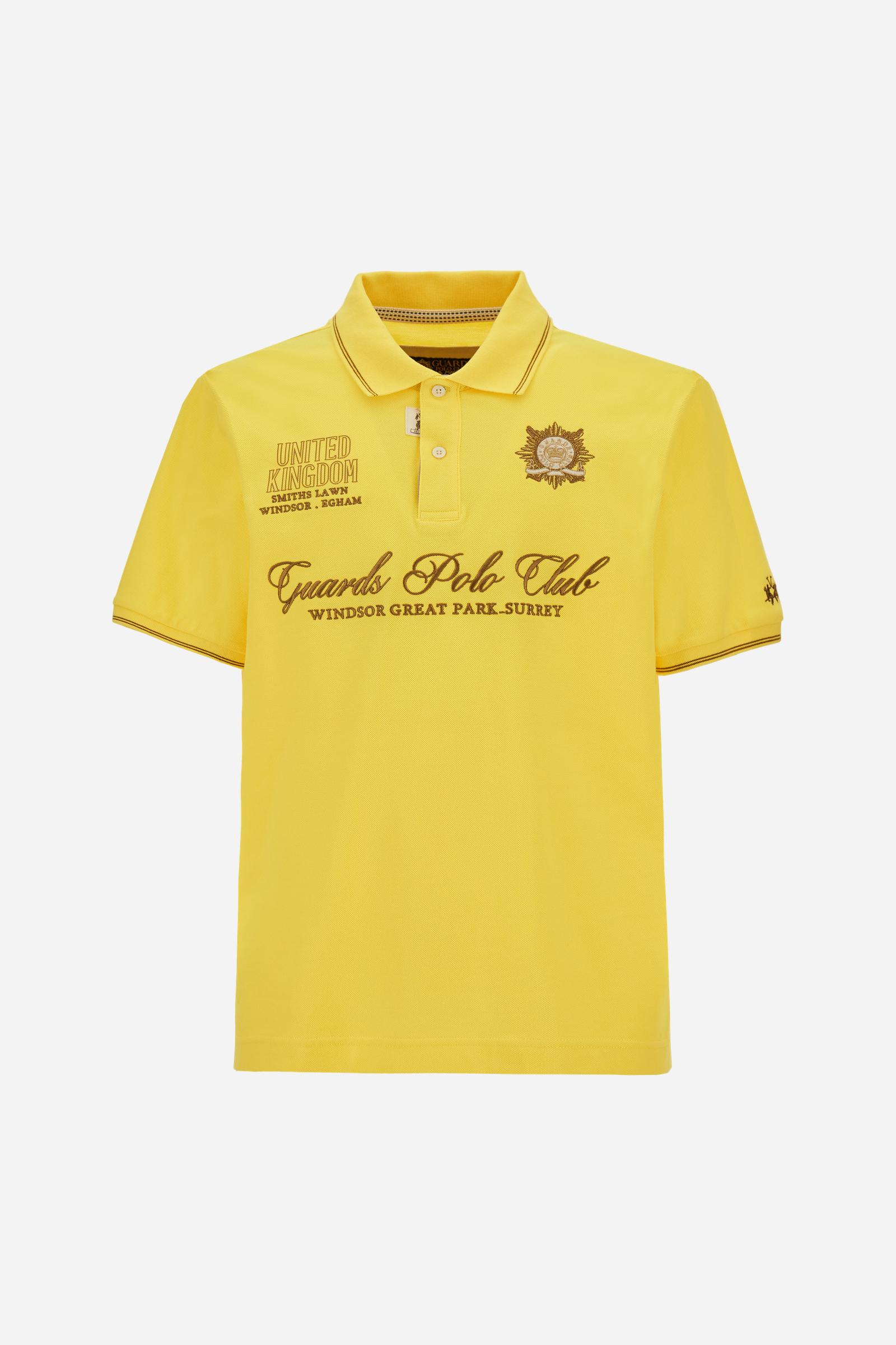 Men’s short-sleeve piqué polo. Contemporary fit with ribbed details on collar and cuffs, enriched with lettering graphics and crests inspired by the Guards Polo Club. - Empire Yellow