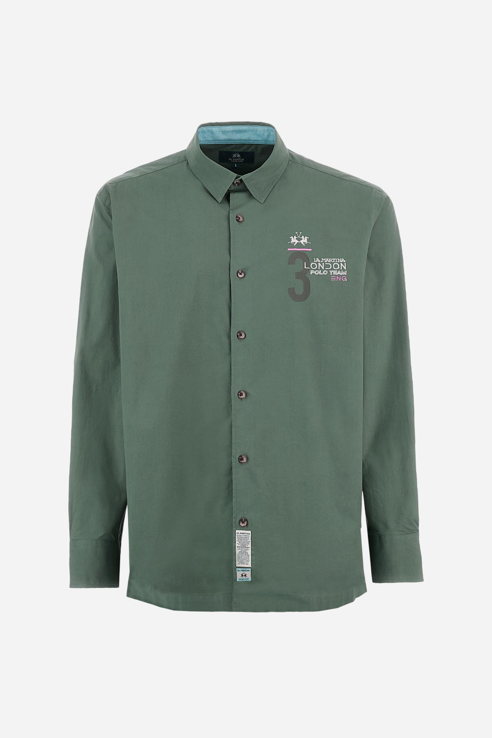 Men's single-colour long-sleeved shirt, made from 100% cotton poplin. Spread collar. Contrasting printed fabric details on the inside of the collar and opening. The numbers on the chest and back graphics are rubberised prints, while the rest of the graphics are embroidered. The logo and La Martina lettering is embroidered on the left chest. The fit is regular. The model is wearing a size L. - Thyme