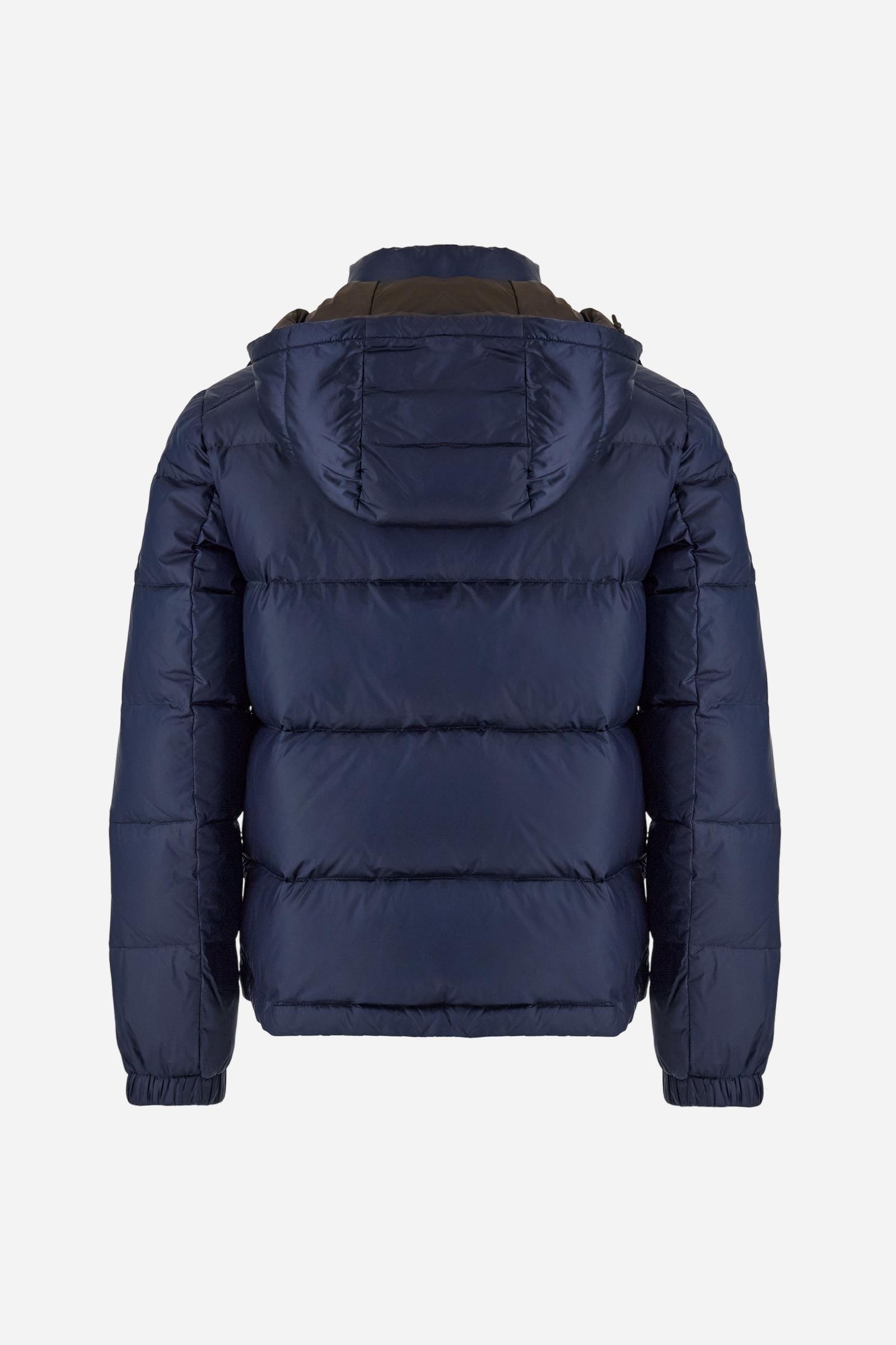 Men’s padded bomber jacket with detachable hood. Made of solid iridescent nylon with contrast lining. Equipped with two practical inner braces for extra comfort. Double customized zip front closure with inner placket featuring contrast Polo Player print, closed with metal snap buttons. Two vertical zipped pockets on the front. Hood with contrast lining and adjustable elastic drawstring. Bold Polo Player graphics printed inside. Regular fit for comfortable movement without bulk. Model wears size L. - Navy