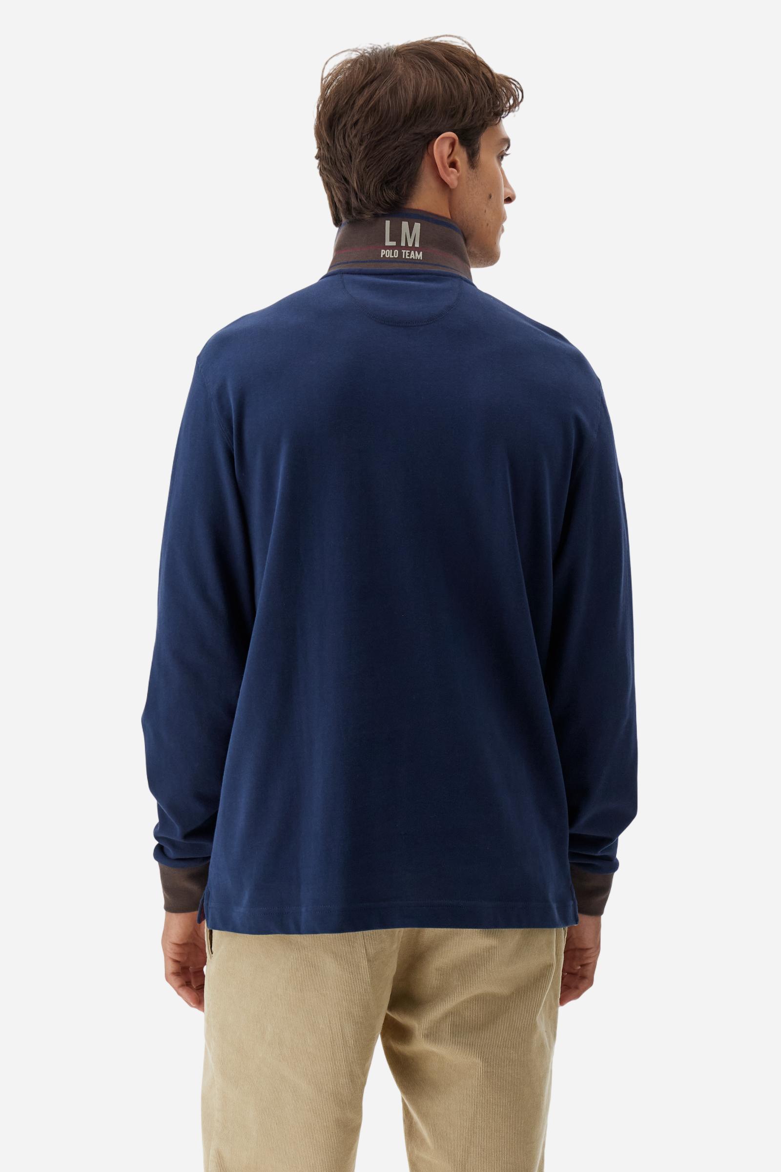 Men’s long-sleeve polo shirt in solid-colour cotton jersey with a warm, matte handfeel. Ribbed collar and cuffs with stripes and colour blocks in contrast, two personalised buttons and contrast details inside the collar. Patches and graphics on sleeves and chest celebrate the Official Polo Supplier team. The large multicolour logo is embroidered on the chest. Regular fit. The model wears size L. - Navy