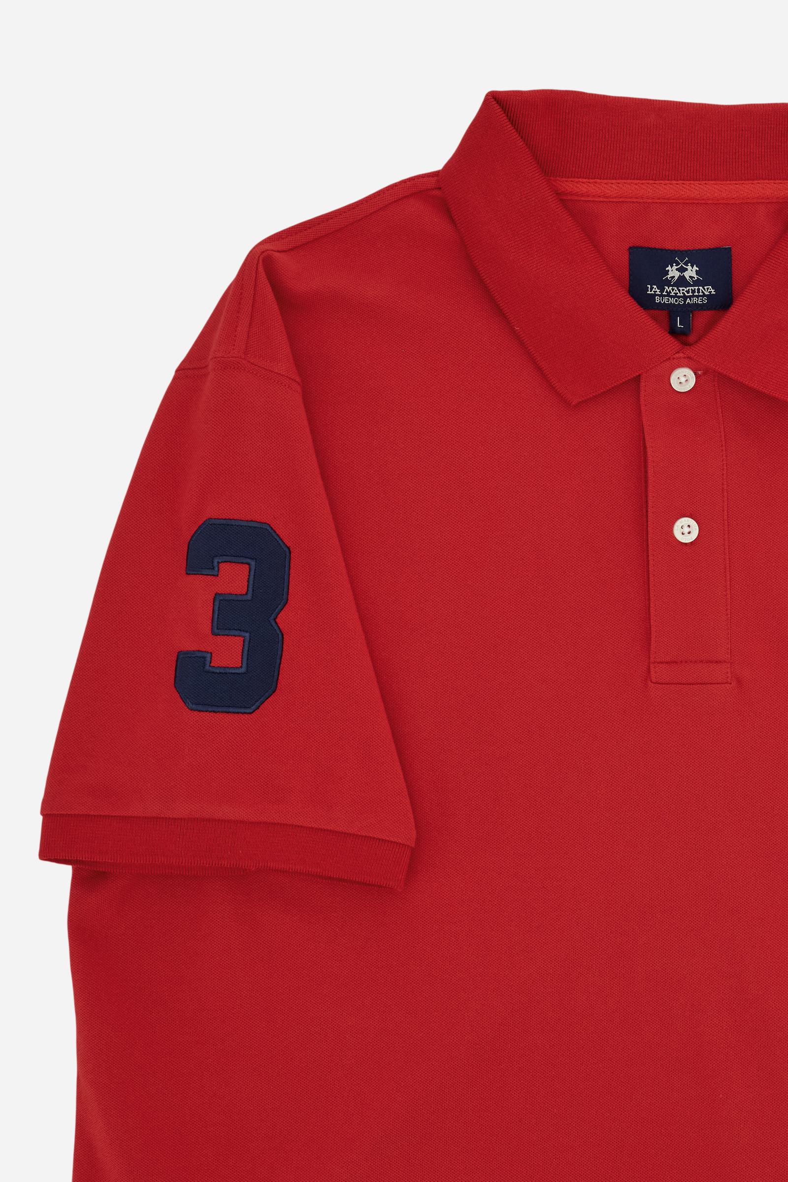 Men’s short-sleeve stretch piqué polo. Two-button placket and ribbed details, with a regular fit. Iconic style characterised by applied logo and patches. - Formula One