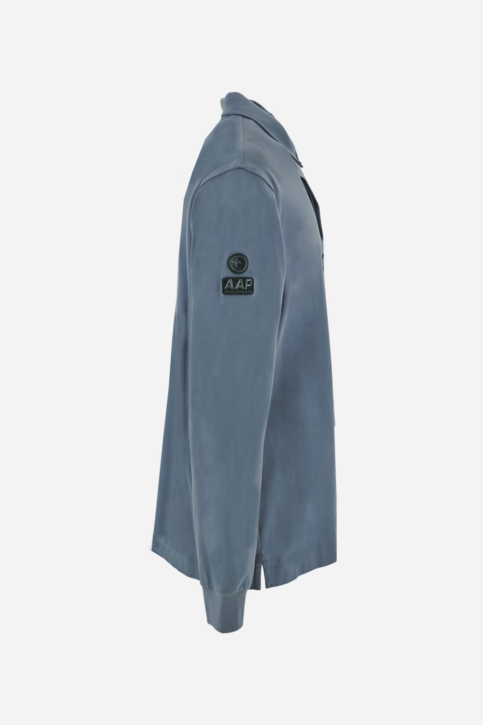 Premium men’s long-sleeve polo shirt in 100% cotton jersey with a smooth, silky texture. Hidden button placket and vertical contrast print. Patches dedicated to the Asociación Argentina de Polo (AAP) on the sleeve and below the opening. Small semi-transparent contrasting logo printed on the chest. Regular fit. The model wears size L. - Flint Stone