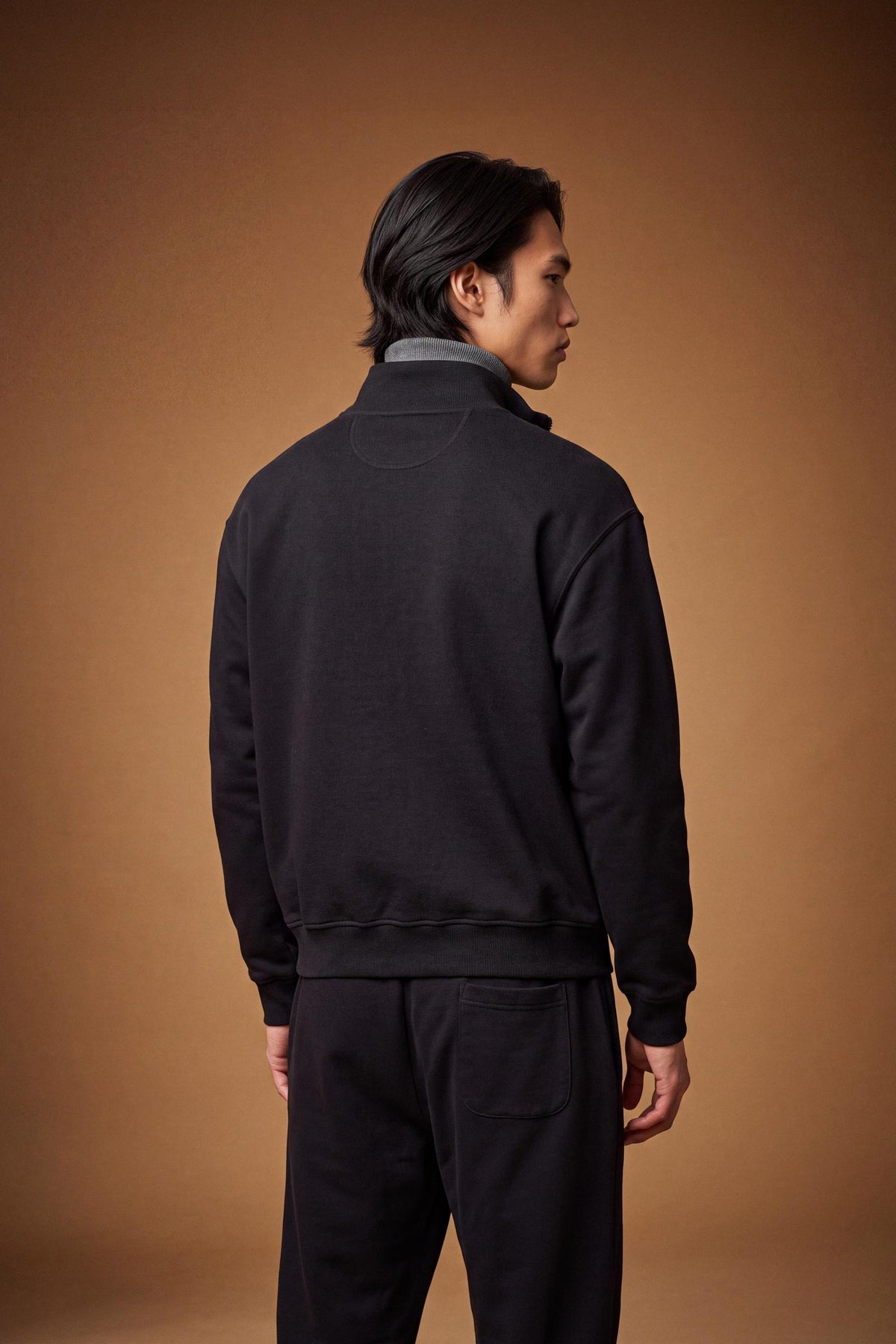 Men's 100% cotton fleece sweatshirt with a high collar, customized zipper, ribbed cuffs and hem, regular fit, and a subtle embroidered logo for comfort and style. - Black