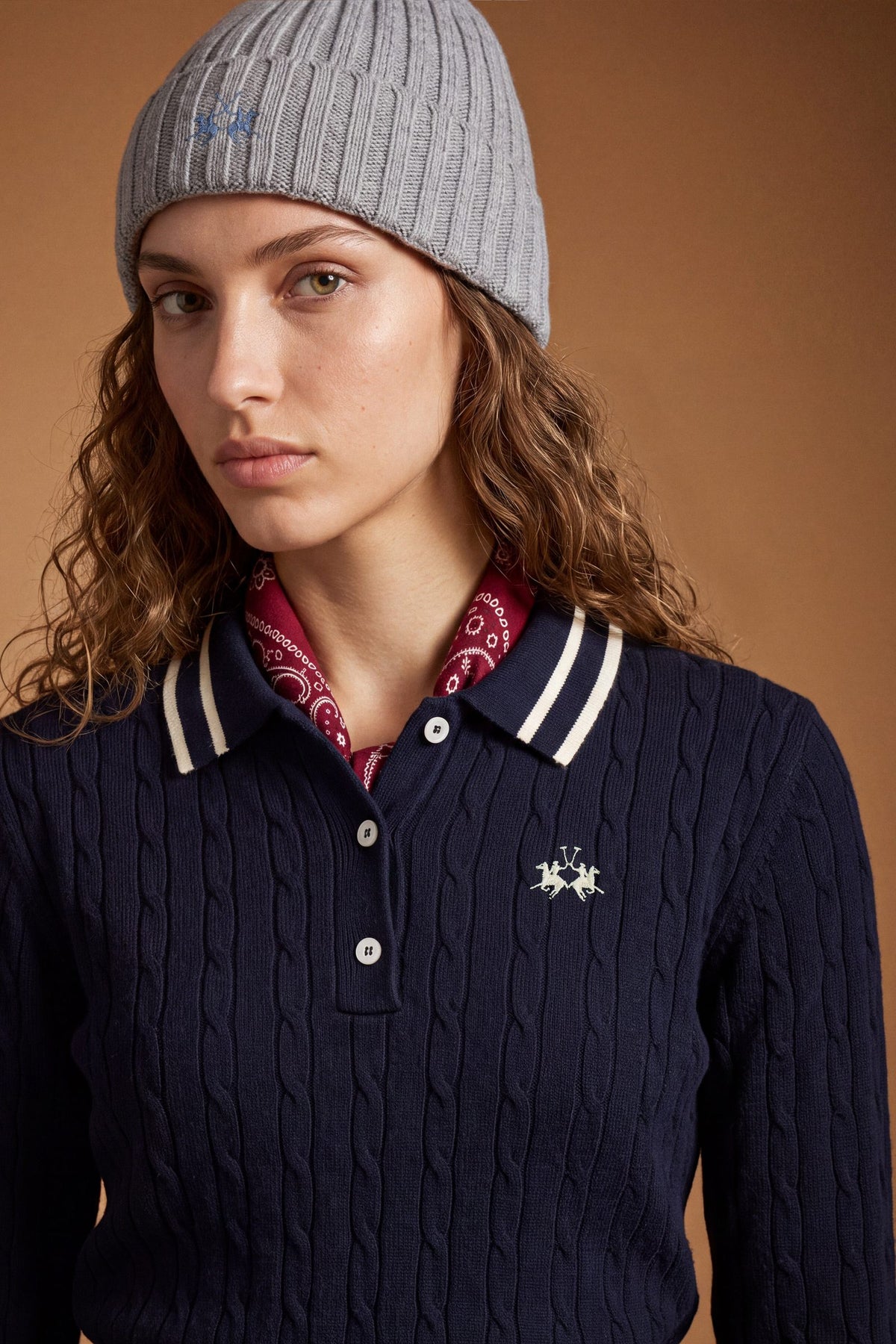 Women's long-sleeve polo in soft lambswool blend, featuring a vertical cable knit, contrast-edged collar, ribbed cuffs, and a slim, comfortable fit. - Navy