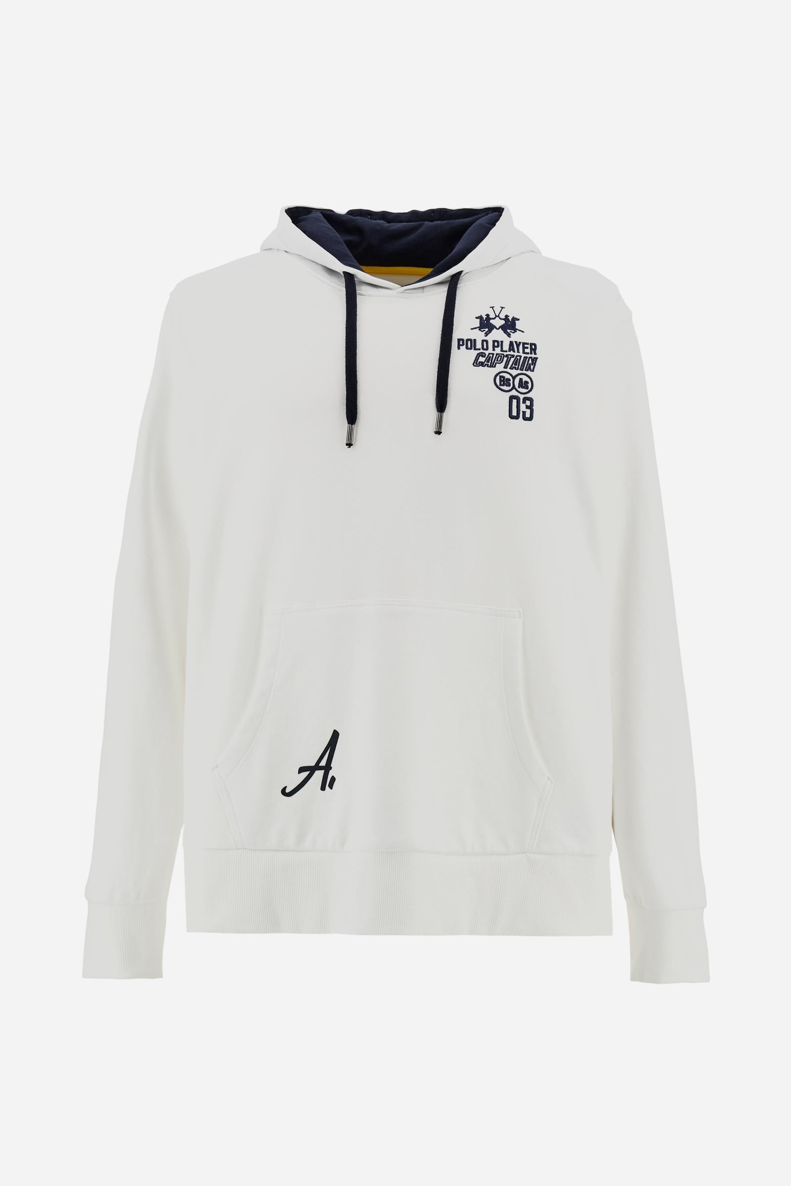 Men’s long-sleeve cotton French terry sweatshirt with a contrast jersey-lined hood, ribbed cuffs, navy embroidery, and a bold Argentina print on the back. - Optic White