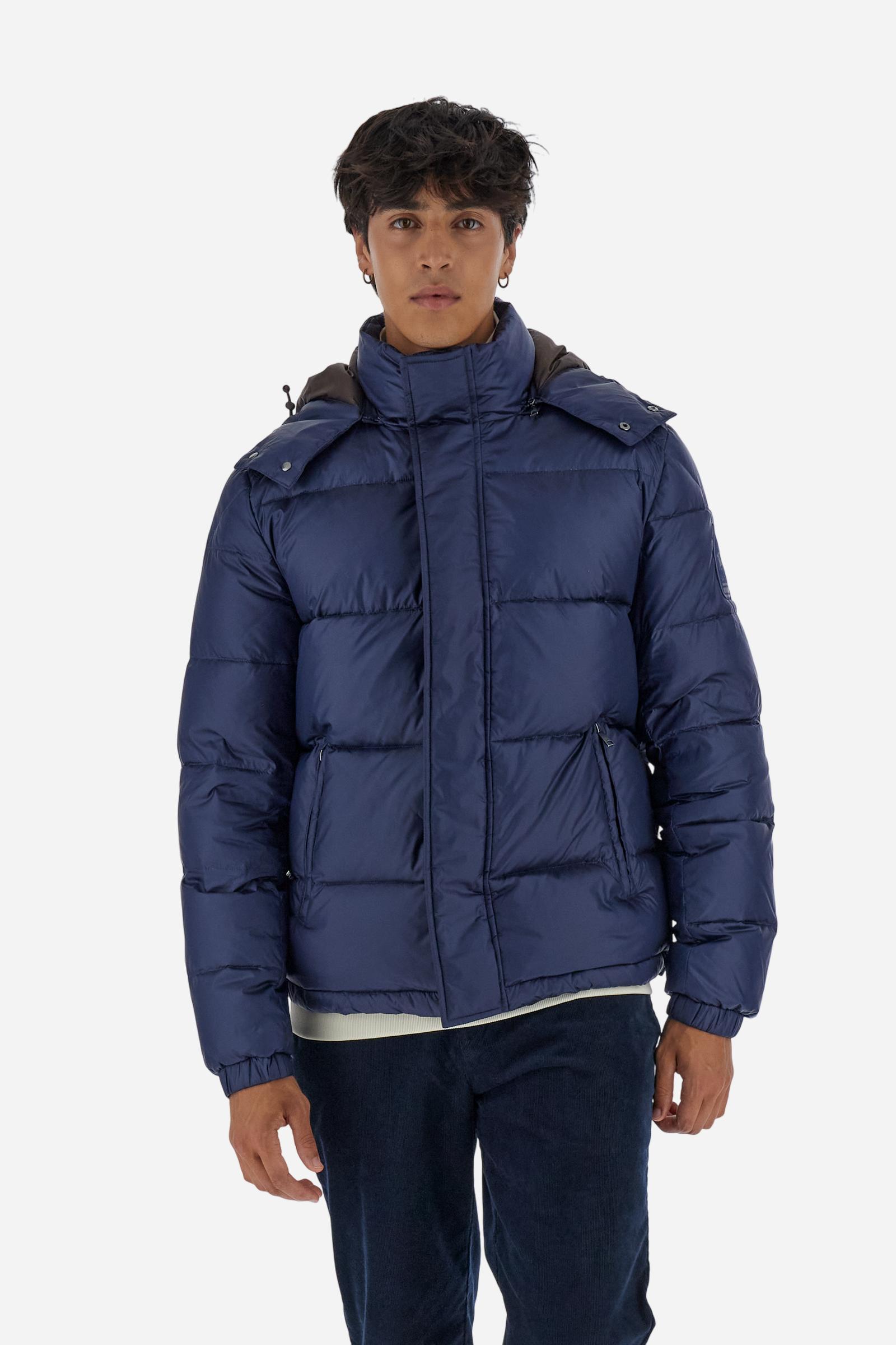 Men’s padded bomber jacket with detachable hood. Made of solid iridescent nylon with contrast lining. Equipped with two practical inner braces for extra comfort. Double customized zip front closure with inner placket featuring contrast Polo Player print, closed with metal snap buttons. Two vertical zipped pockets on the front. Hood with contrast lining and adjustable elastic drawstring. Bold Polo Player graphics printed inside. Regular fit for comfortable movement without bulk. Model wears size L. - Navy