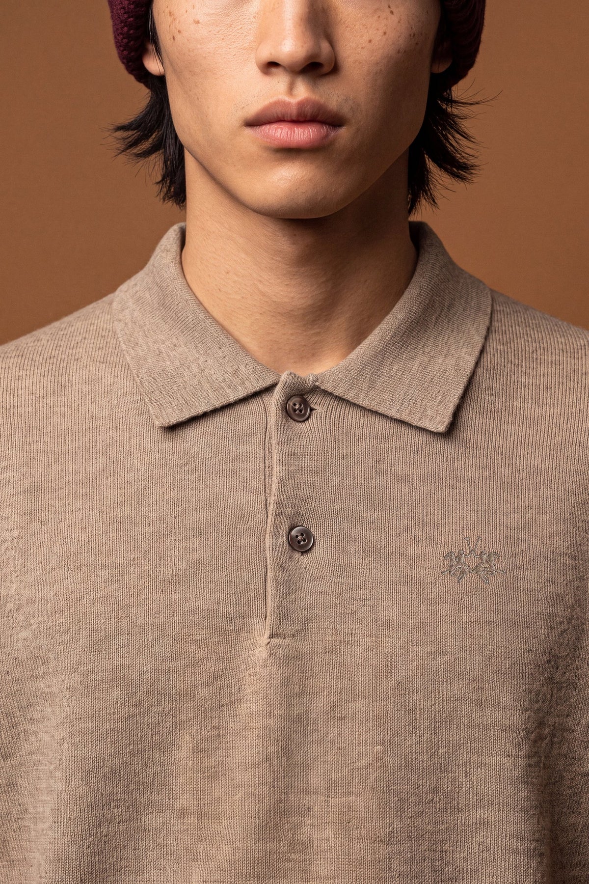 Men's long-sleeve polo made from 100% merino wool offers a comfortable fit, classic knitted collar, ribbed cuffs, and a subtle embroidered logo on the chest. - Vintage Khaki