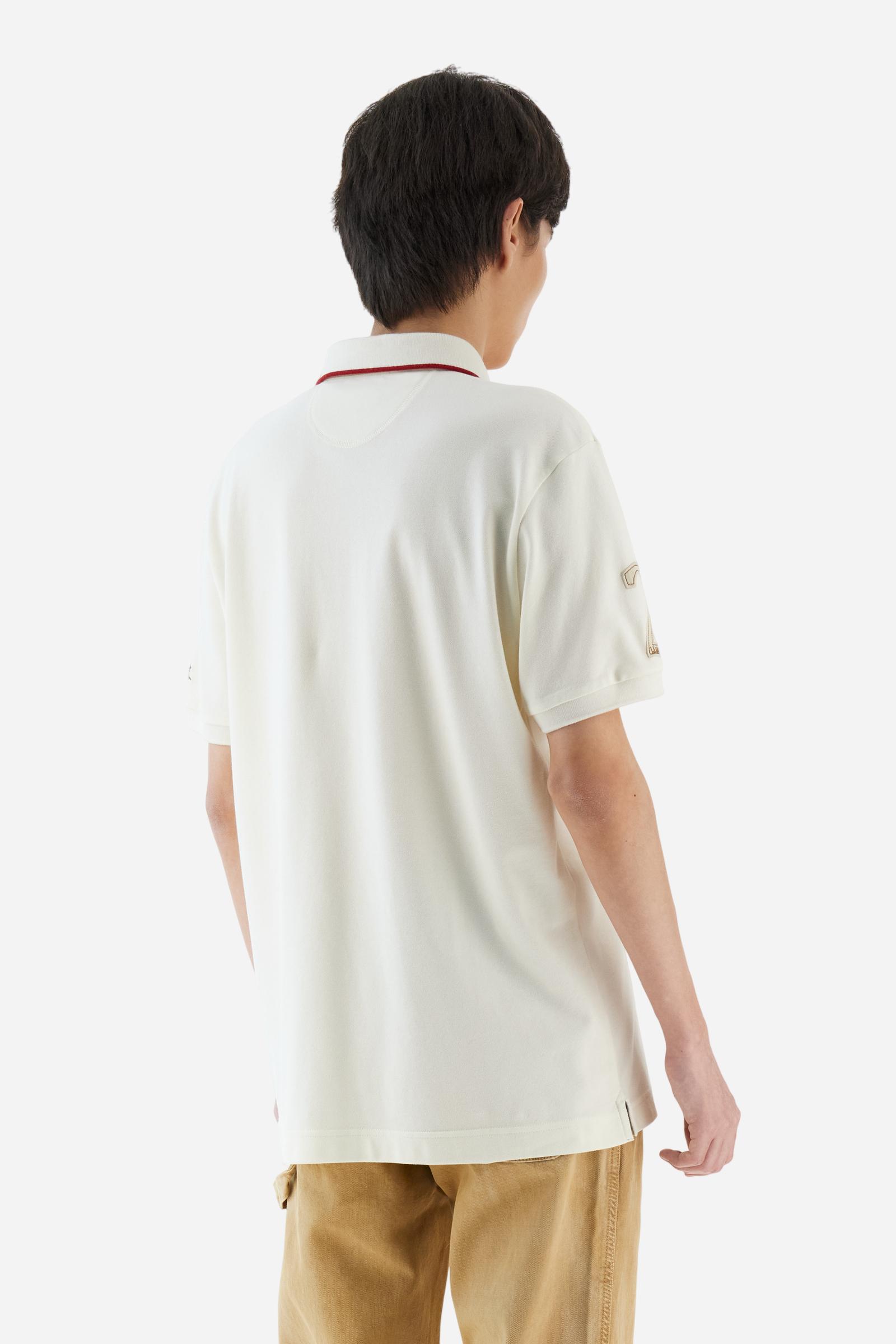 Short-sleeve polo shirt from the Guards capsule, made of high-quality stretch cotton piqué. Ribbed collar and cuffs in matching tone, with contrast striped detail on the collar. Three-button personalized placket. Multicolor graphics, patches, and lettering celebrate the British regiment, applied to chest and sleeves. Brand logo embroidered in contrast on the left sleeve. Regular straight fit. Model wears size L. - Pristine