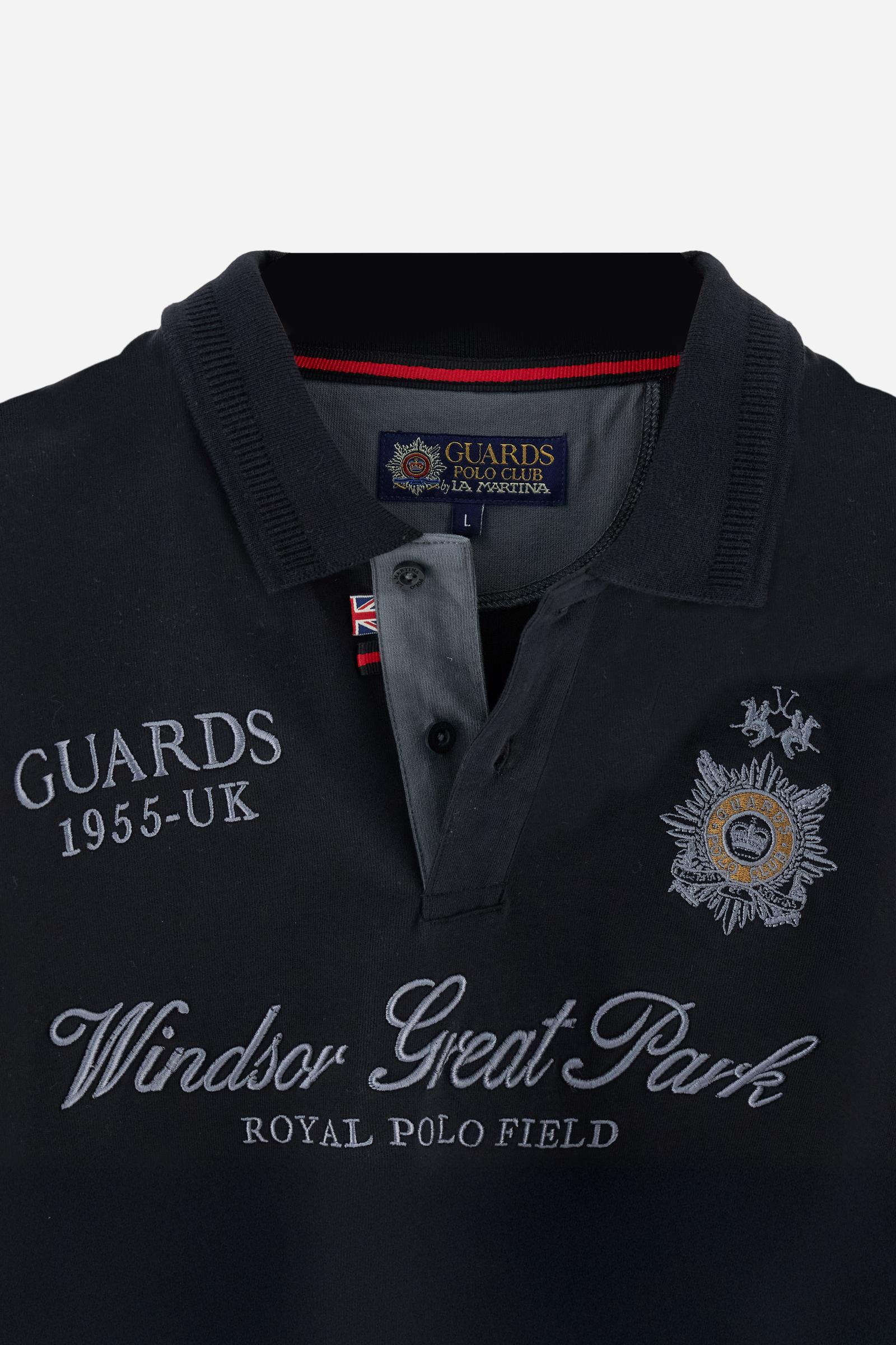 Long-sleeve polo shirt in warm cotton jersey. Ribbed collar with subtle textured detail, contrast undercollar and placket. Logo and Guards crest embroidered in contrast on the chest, paired with raised embroidered lettering inspired by Windsor tradition and British polo. Regular fit for an elegant yet relaxed style. Model wears size L. - Black