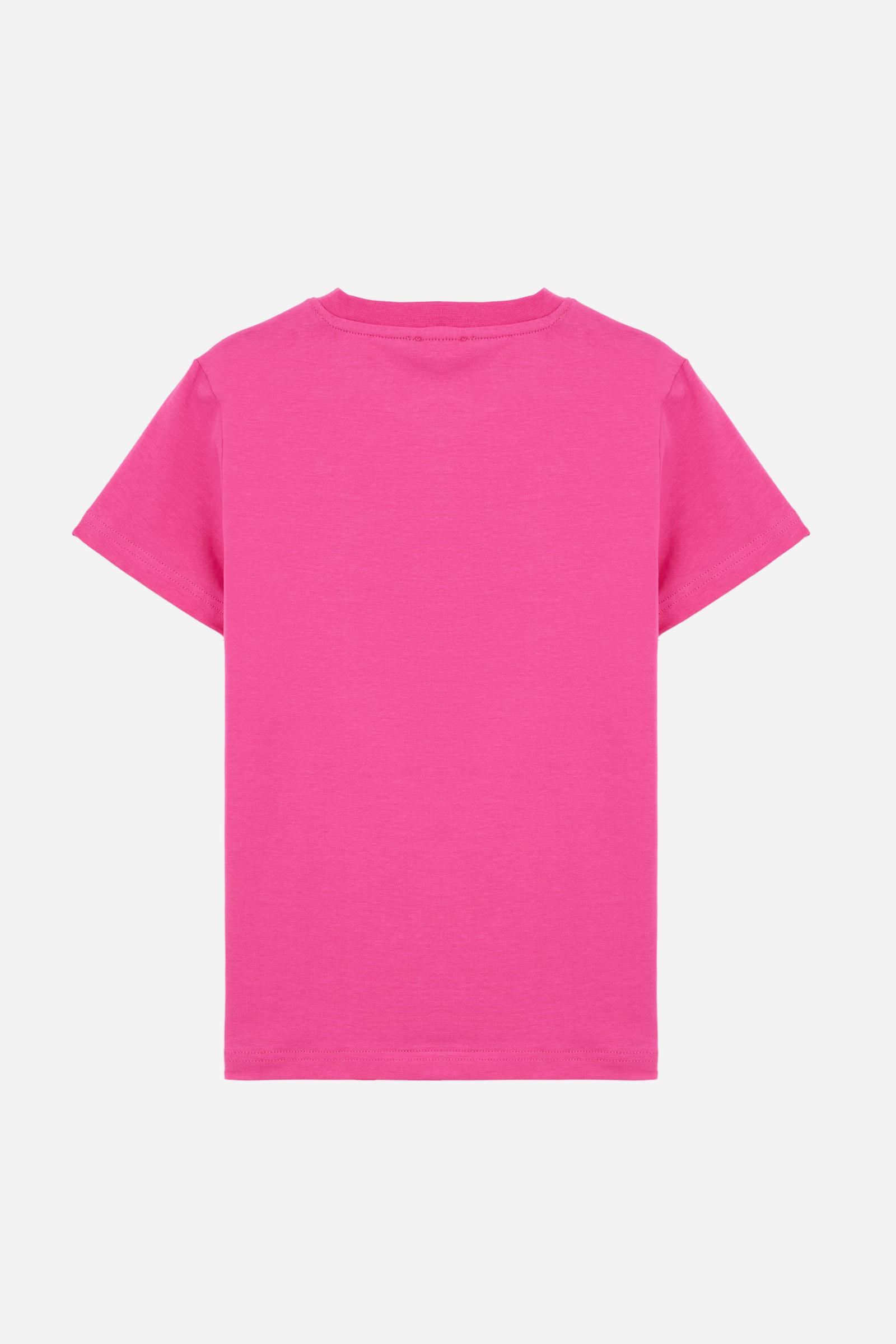 Short-sleeved T-shirt for girls made from soft 100% cotton jersey in a solid colour. The style features a regular fit and tonal ribbed crew neck. The maxi front print, featuring the iconic crossed polo players logo and La Martina lettering, enhances the garment with a sporty and recognisable style. - Fandango Pink