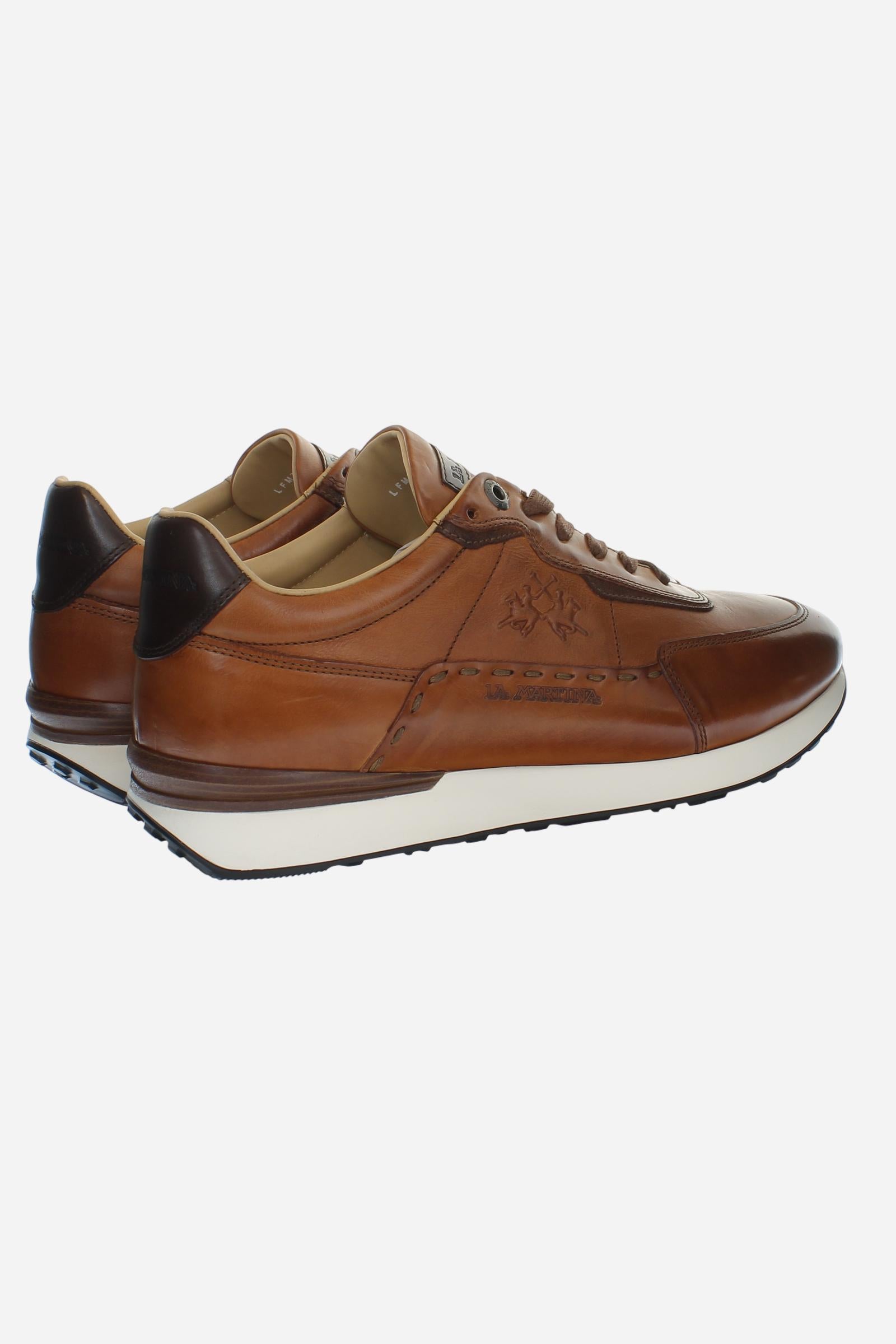 Sporty and elegant leather trainers with ultralight technical soles in XL Extralight EVA. Perfect for anyone in search of comfort, performance and handcrafted details. - COGNAC